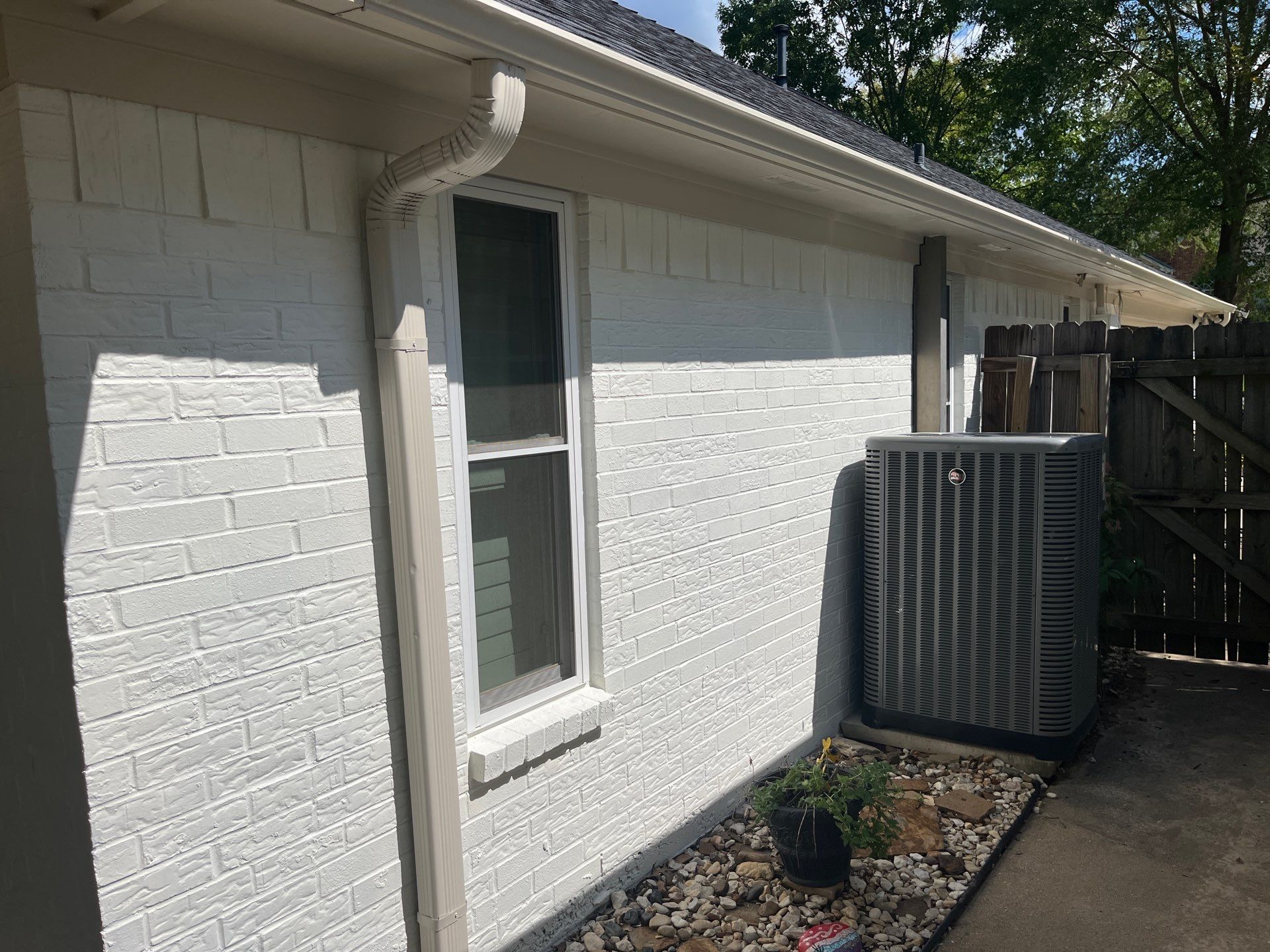 Exterior Painting in Tyler, TX | Brick House with White & Blue Finish by Quality Coats Painting