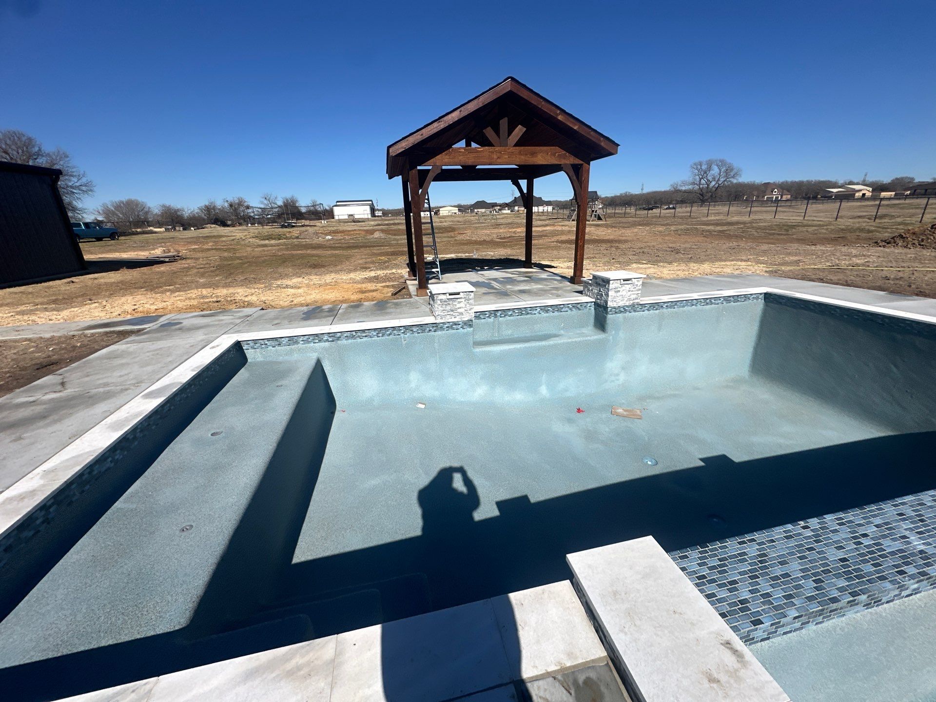 Geometric Pool with Tanning Ledge and Cedar Pergola by Pinnacle Pools and Spas - DFW