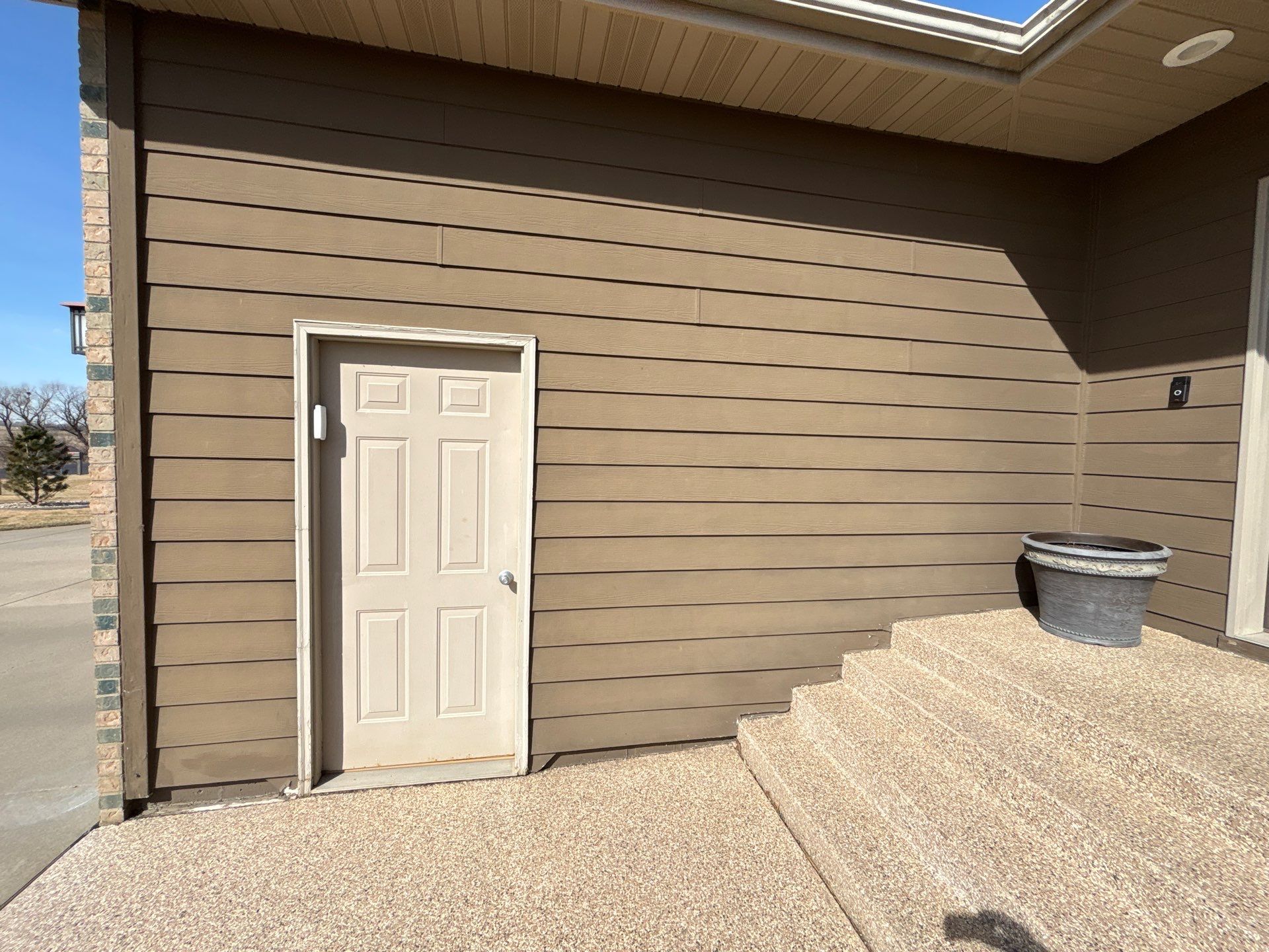 Full Exterior Renovation with Stone Veneer and Composite Decking by Select Painting, Coatings & Garage Cabinets