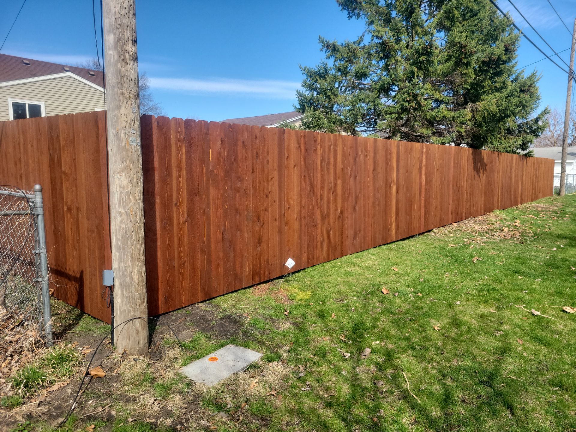 Custom Chestnut Stained Cedar Privacy Fence in Waterloo by Perfect Picket Fence and Stain