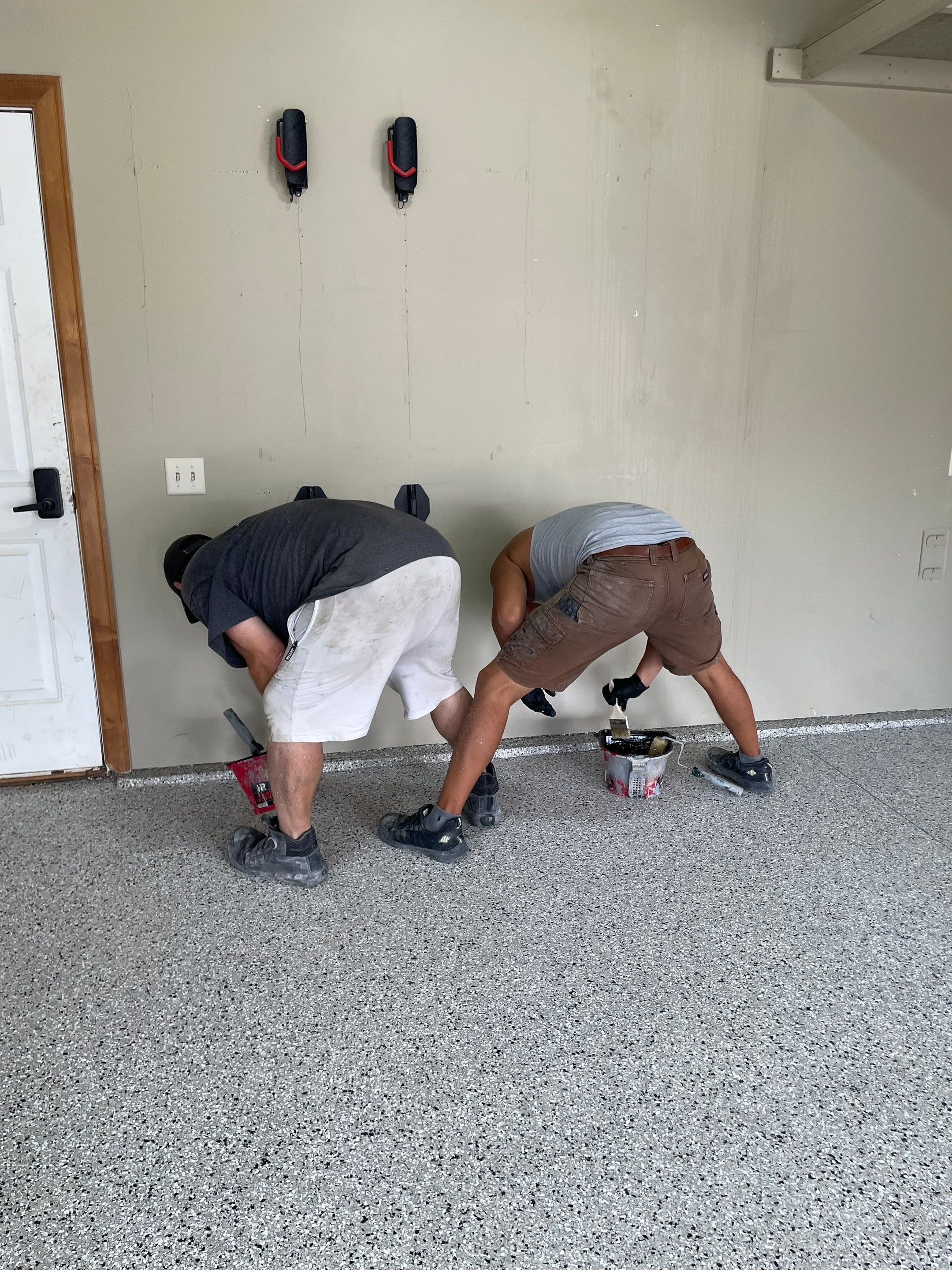 Cabin FEver Flake Garage Floor Coating Installation in Sioux Falls by Select Painting, Coatings & Garage Cabinets