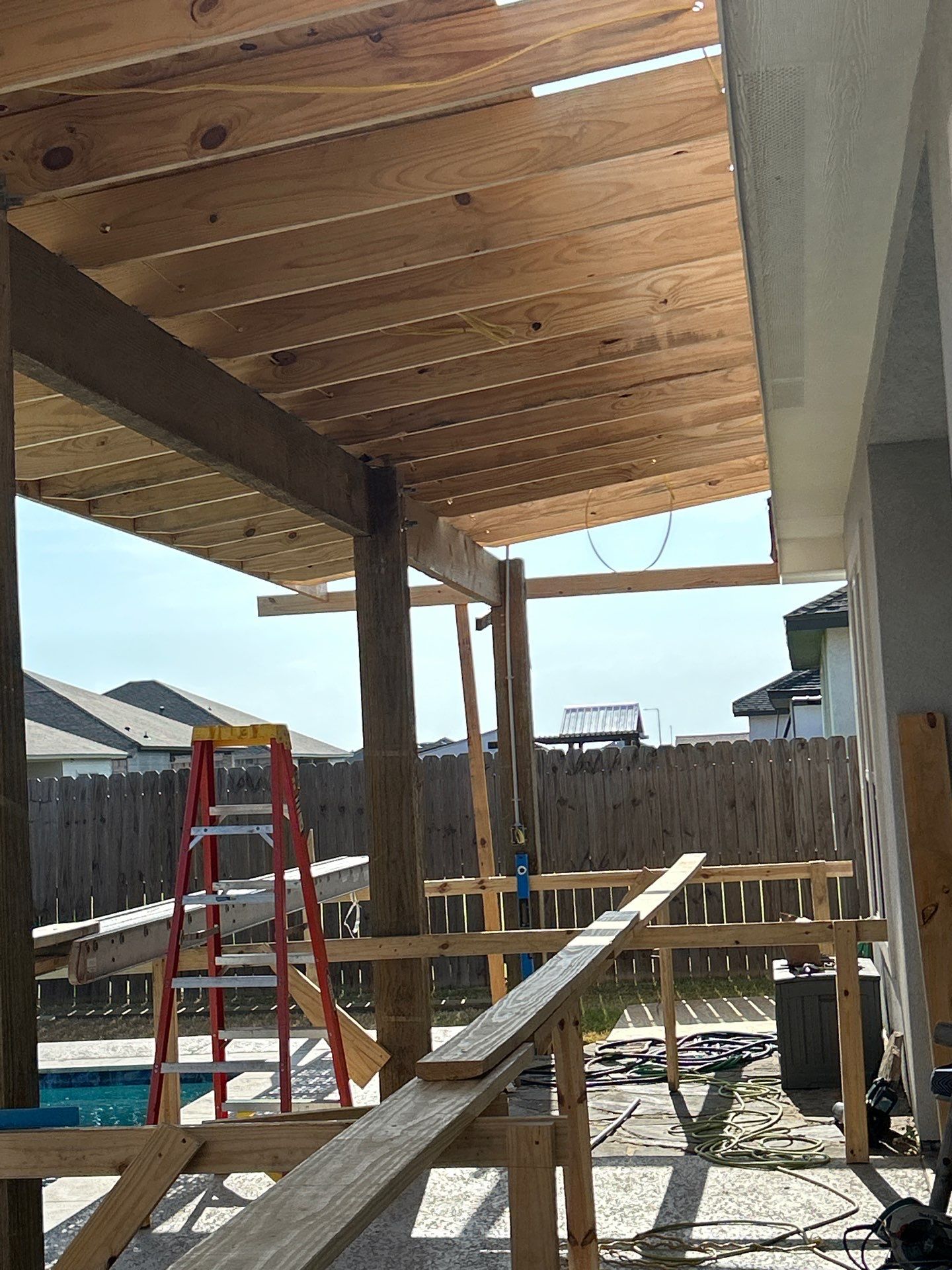 Patio Pool Cover by Bayfront Roofing and Construction