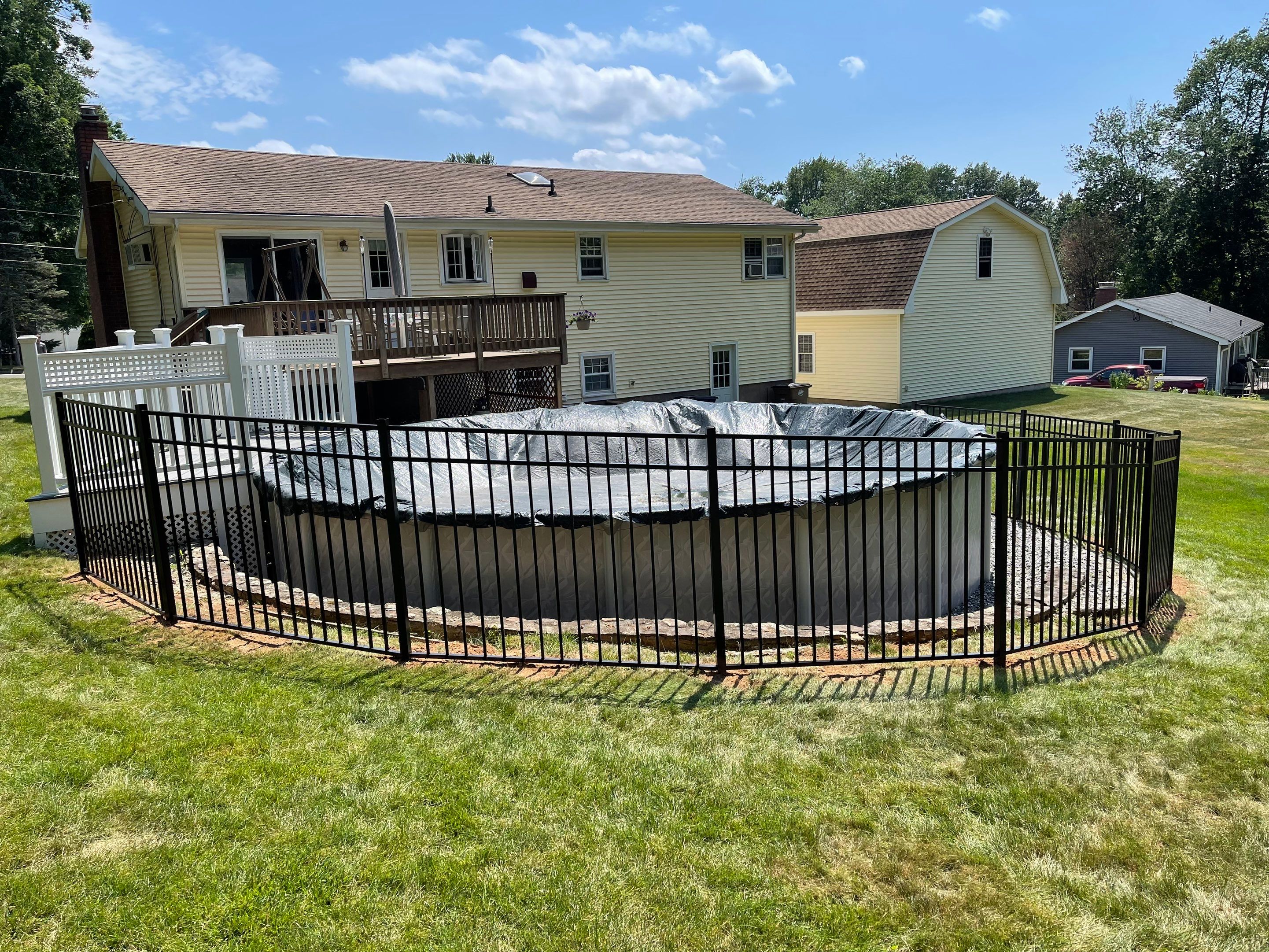 New Aluminum pool fence with matching gate and pool latch by DiGiorgi Roofing and Siding Inc