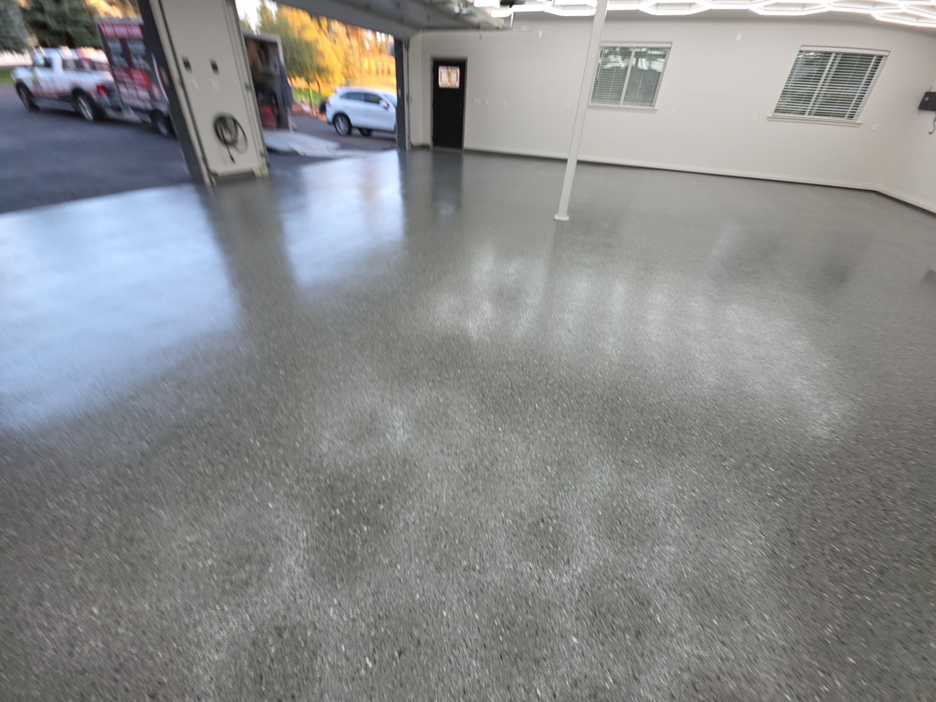 Custom Garage Transformation with Polyaspartic Coating and Hexagonal LED Lighting by Croc Coatings, LLC