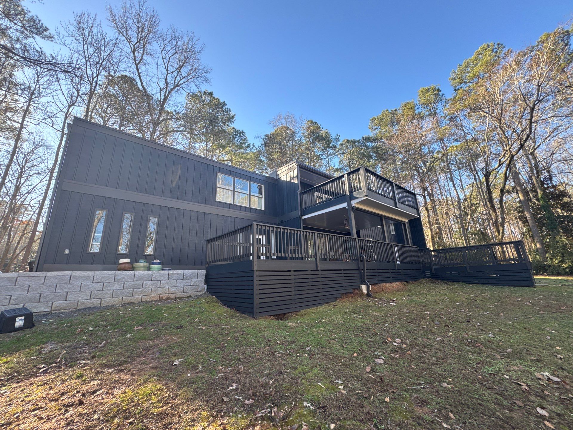 Full Exterior Transformation With Modern Black Finish by Swift Home Renovations