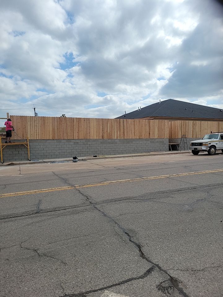 Cedar Fence using Cedar Pickets and Metal Poles by Clays Services Inc