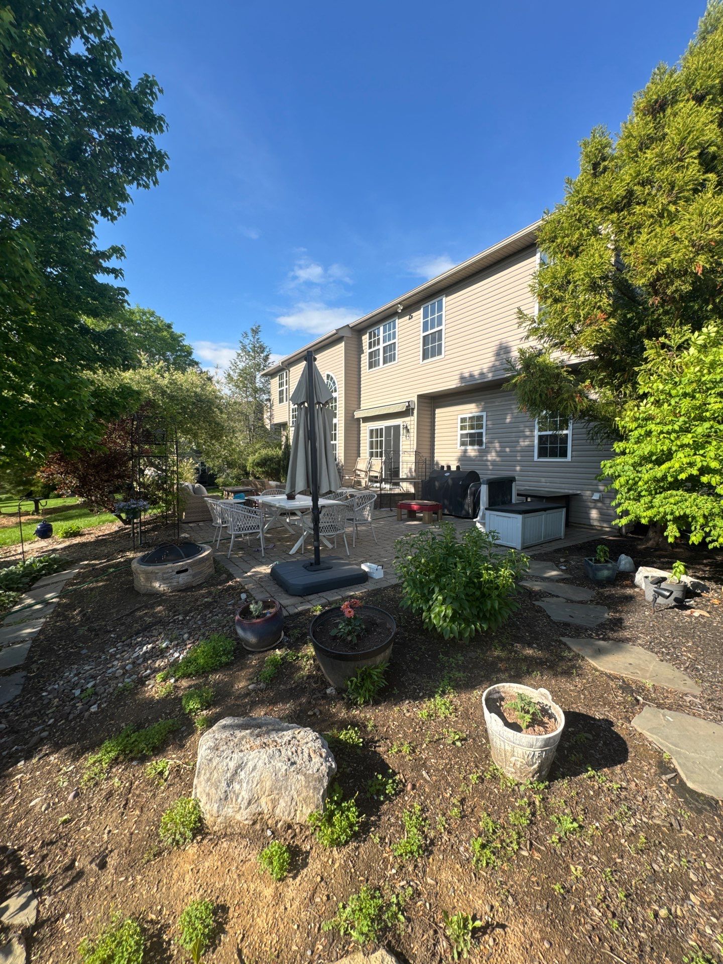 Backyard Retreat: Techo-Bloc Patio + Firepit Lounge by Saylor’s Lawn & Landscape