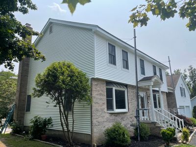 Siding Installation using Mainstreet Colonial & White gutters