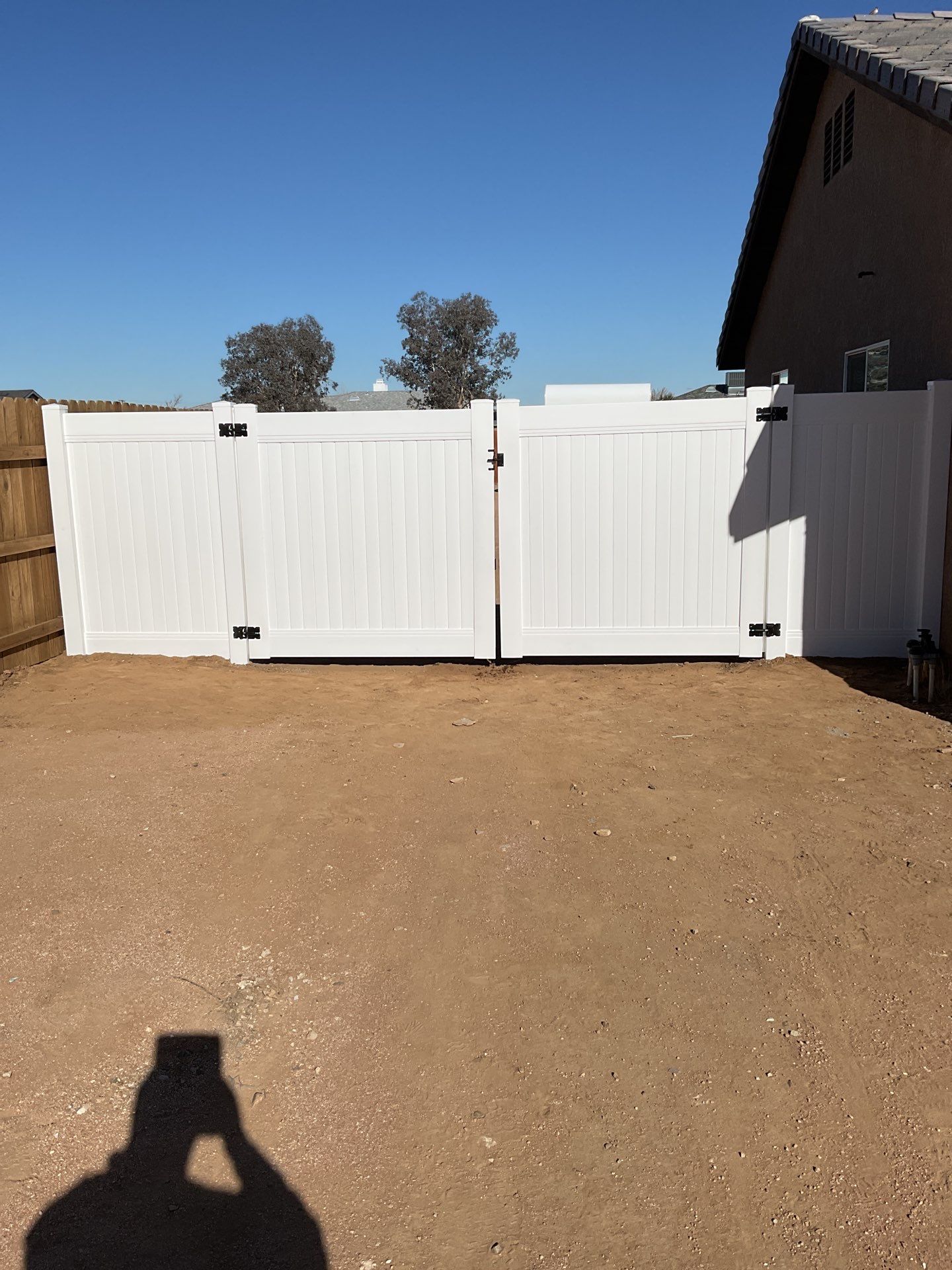 Gate installation using Vinyl by Fence Guys Inc. 