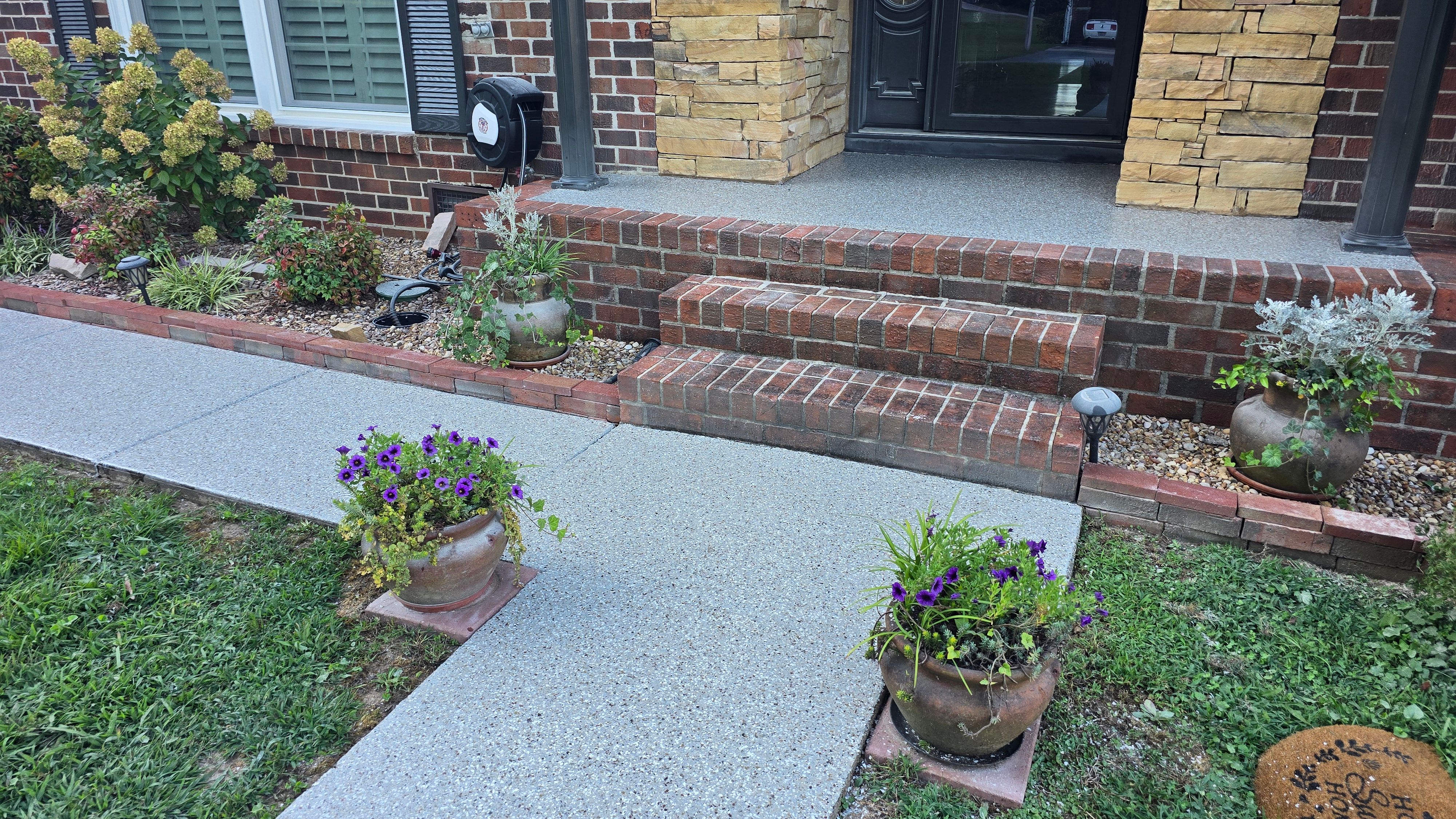 Driveway, Garage, Porch, and Sidewalk using Creekbed by Elite Floor Solutions