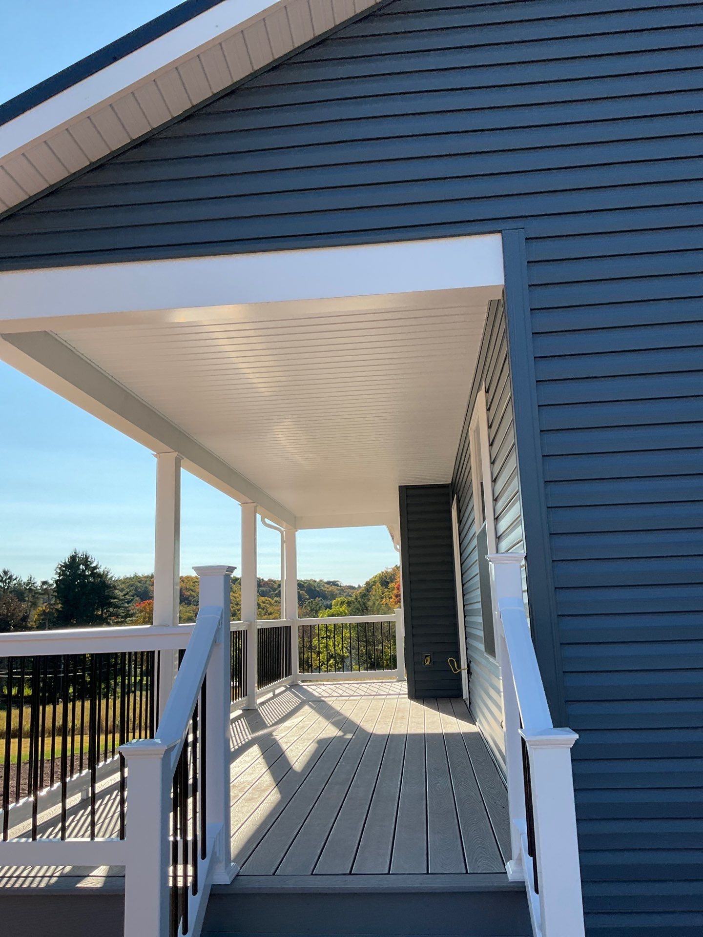 New Residential Addition with Blue Siding and Metal Roofing in Ashland by Esh Builders