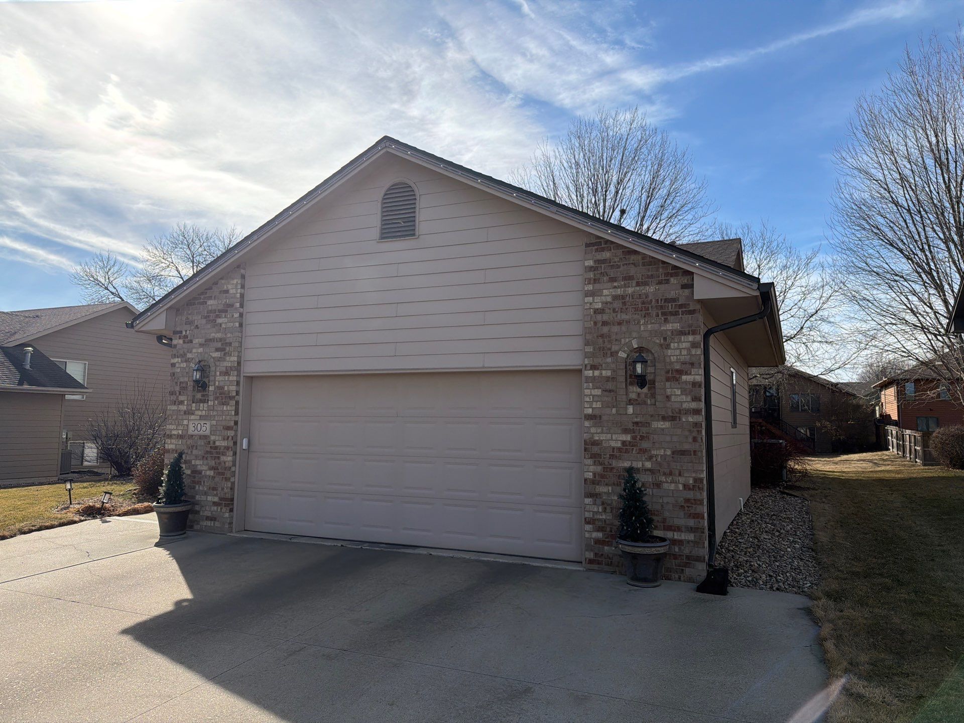 Residential Exterior Painting and Trim Restoration in Sioux Falls by Select Painting, Coatings & Garage Cabinets
