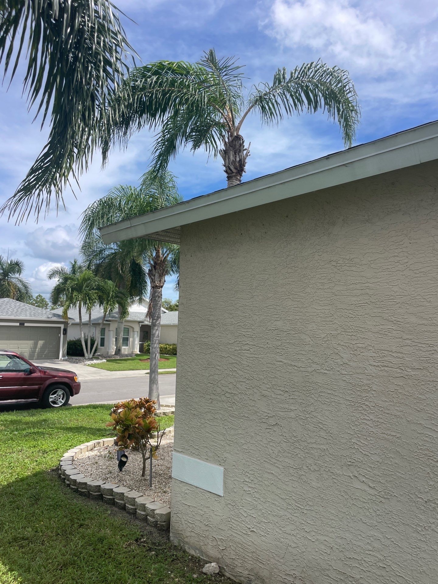 White Aluminum Seamless Gutters and Downspouts in Estero FL by Gutter Professors