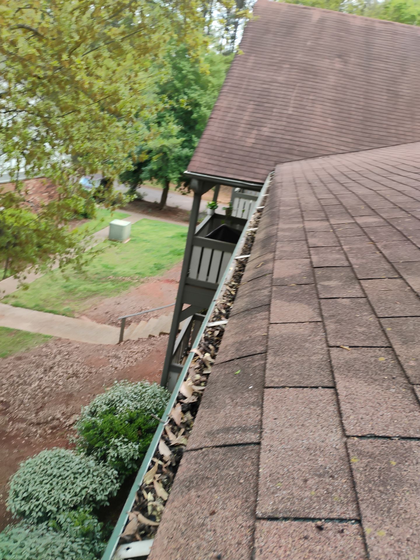 Commercial gutter cleaning Athens, GA before photo with filled gutters