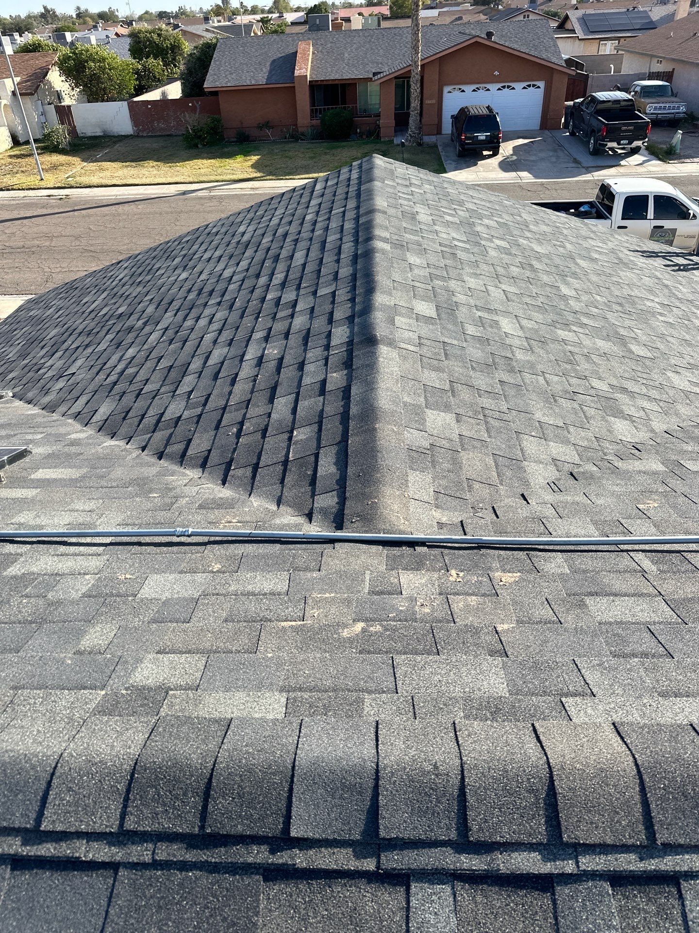 Charcoal Shingles by Reimagine Roofing