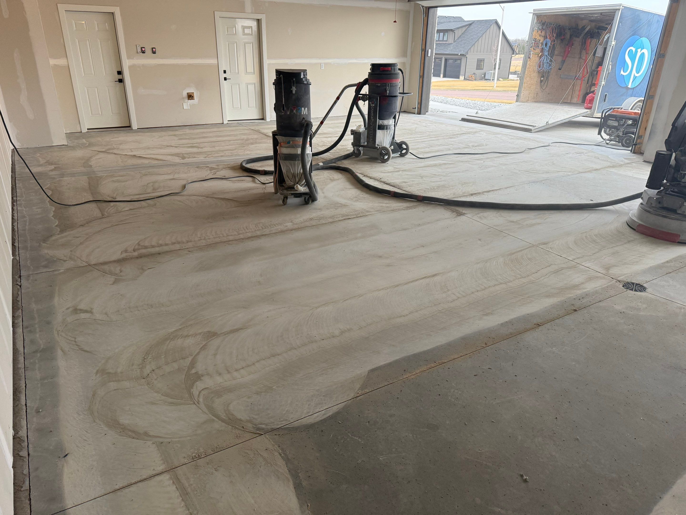 Grey Speckled Epoxy Floor Coating for Sioux Falls Garage by Select Painting, Coatings & Garage Cabinets