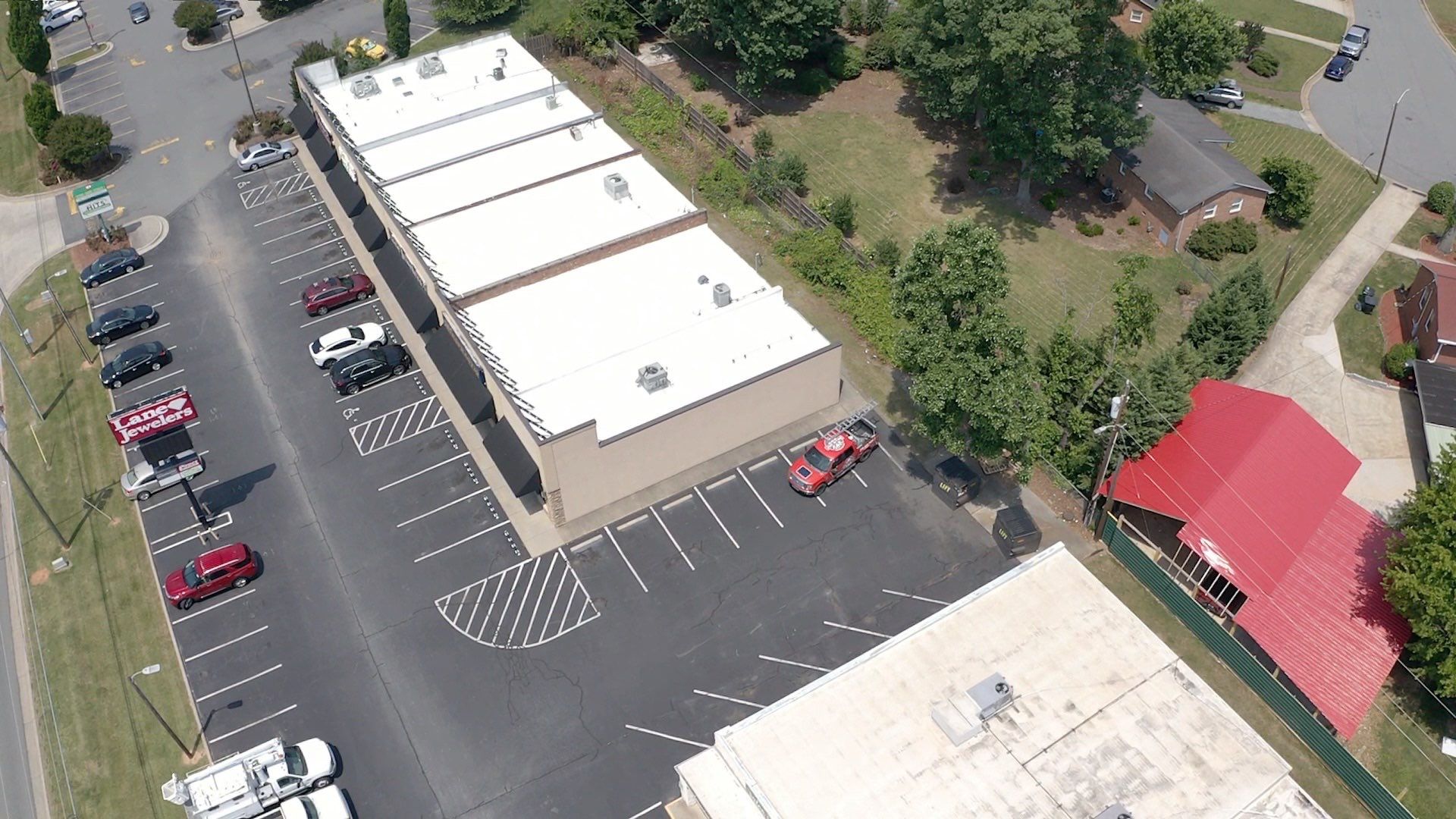 Commercial Roof Coating using Fiberseal basecoat and Silicon Topcoat by Just In Time Roofing and Restoration