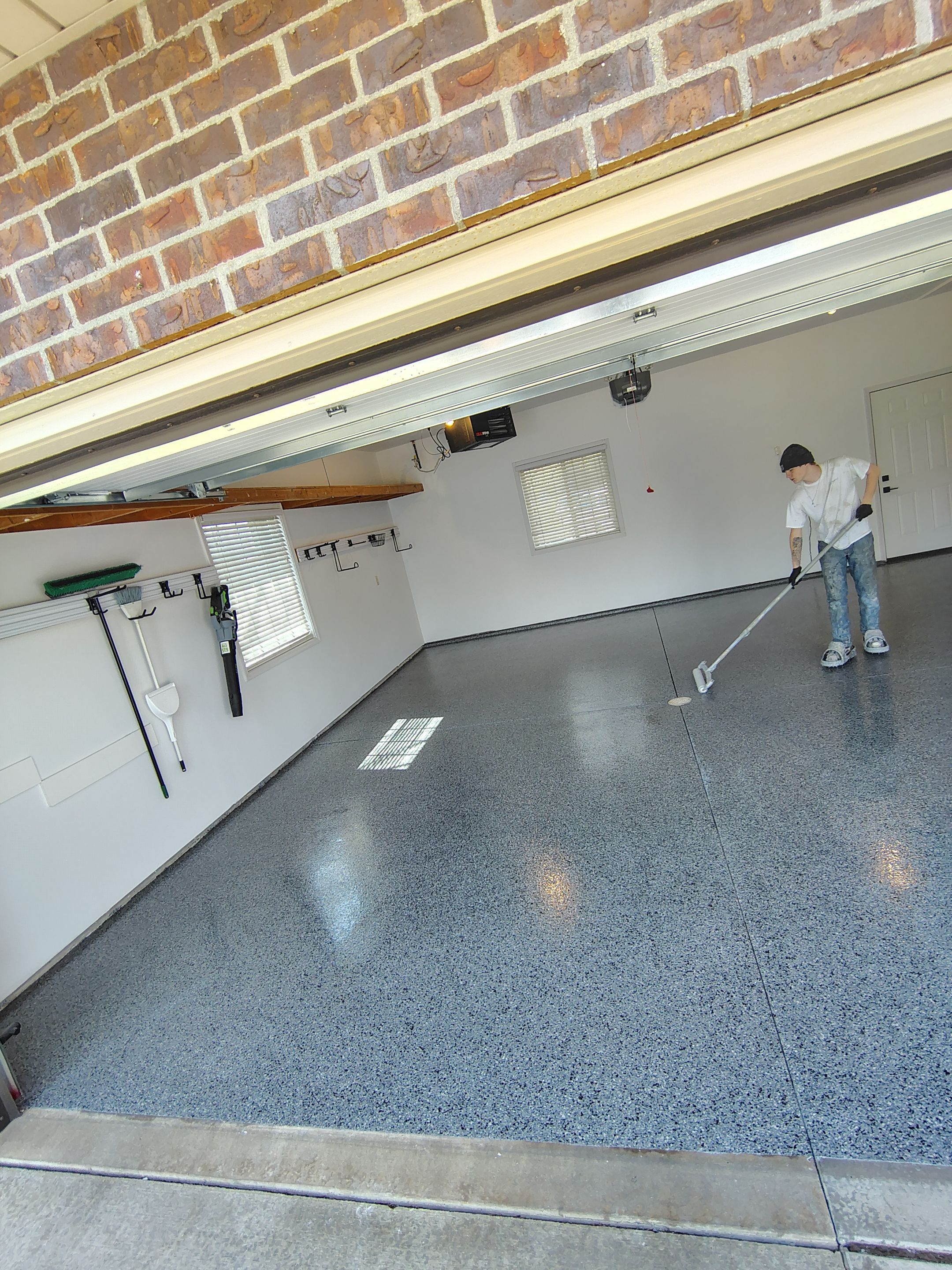 Grey Speckled Epoxy Garage Floor Coating in Sioux Falls by Select Painting, Coatings & Garage Cabinets
