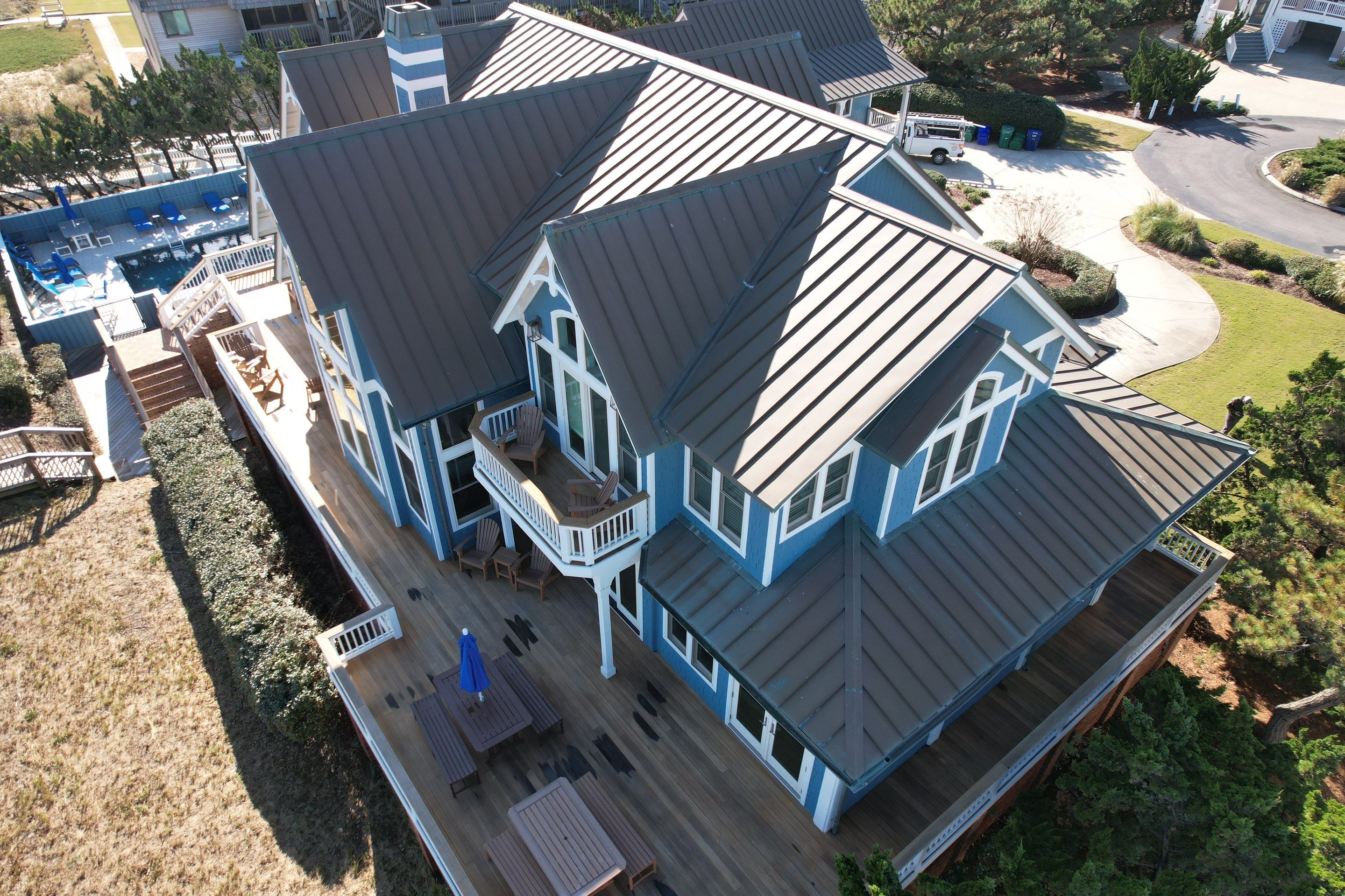 Large Metal Roof Transformation by Gallop Roofing & Remodeling, Inc.