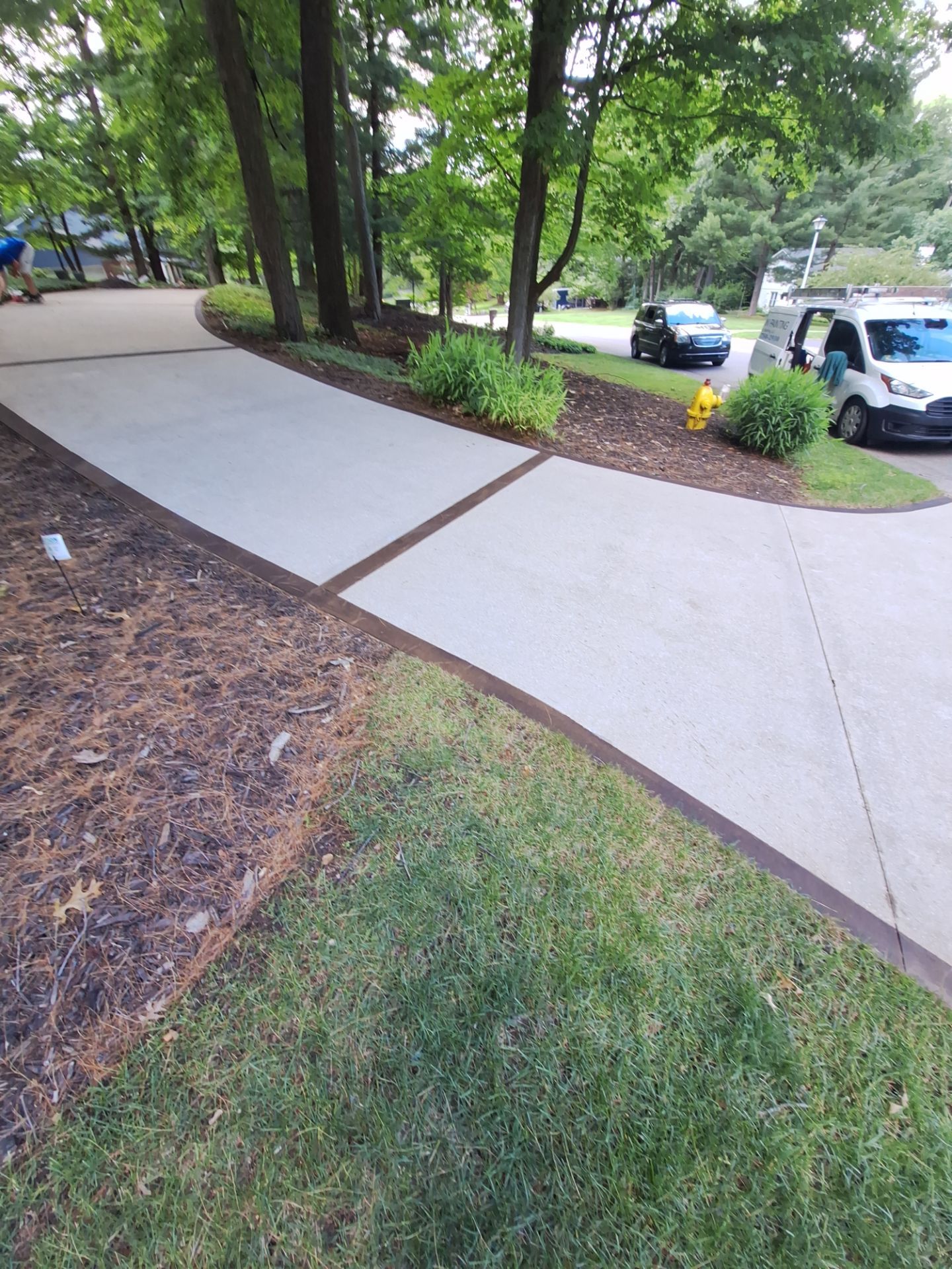 Concrete Driveway and Walkway Staining With Espresso Borders in Grand Rapids by Gordon Painting