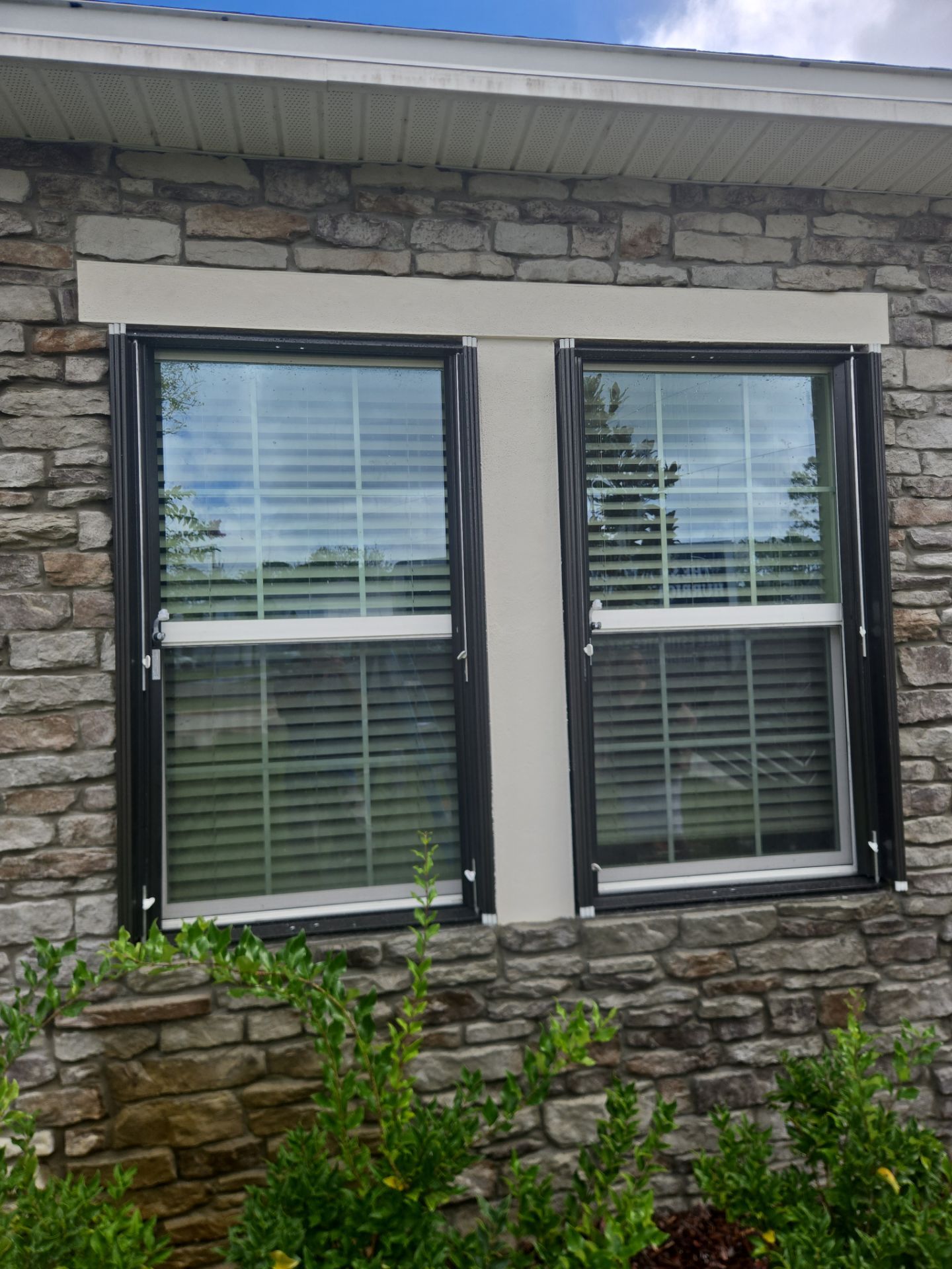 Accordion Shutters with Port Holes by Smart Guard Shutters