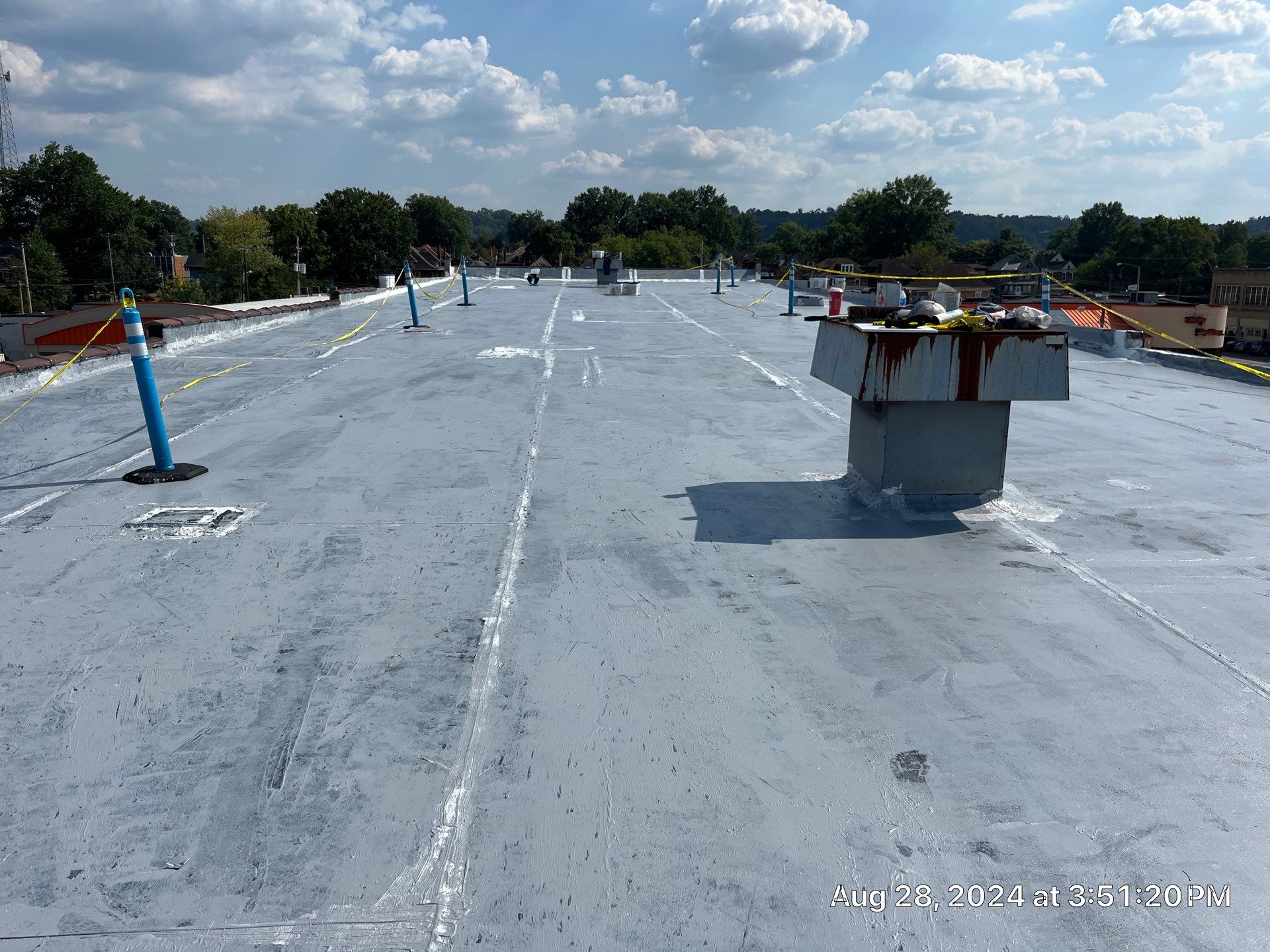 Commercial Roofing Installation using smartcoat Roof coating by Fahey Roofing + Contracting