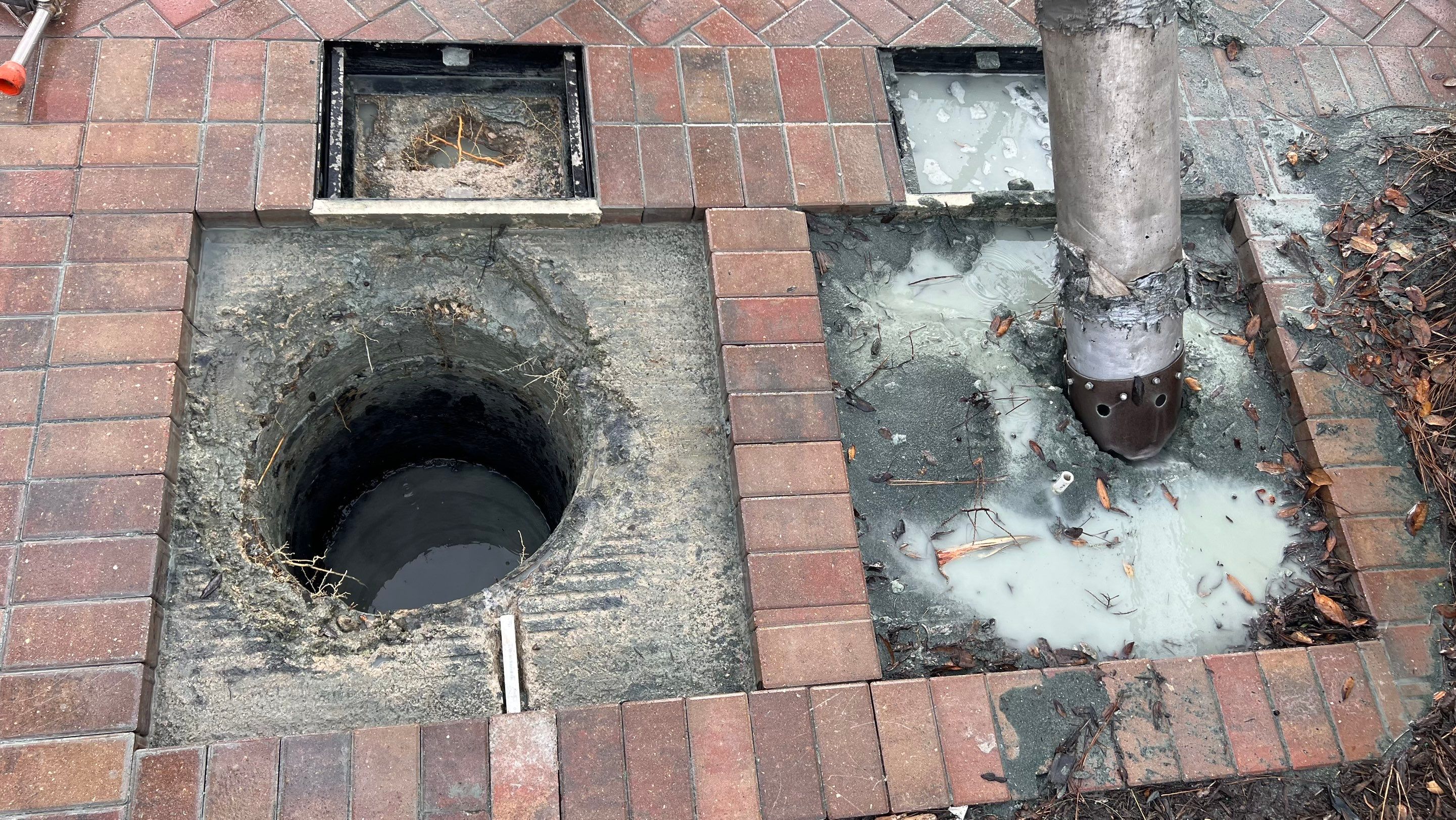 Pelican Landing Tennis Court Catch Basin Cleaning by APS Power & Water
