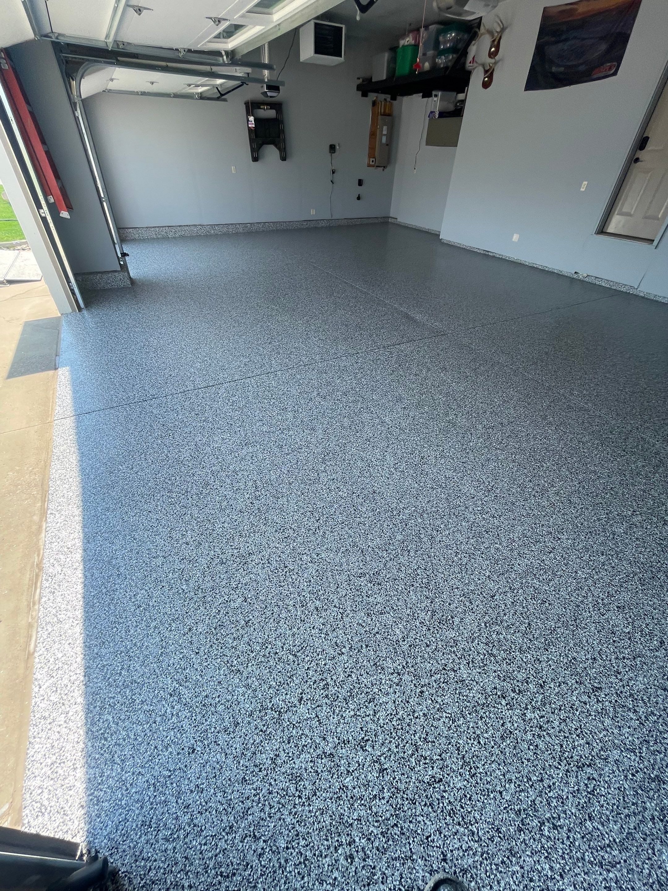 Sioux Falls Garage Concrete Coating Installation with Domino Flake by Select Painting, Coatings & Garage Cabinets