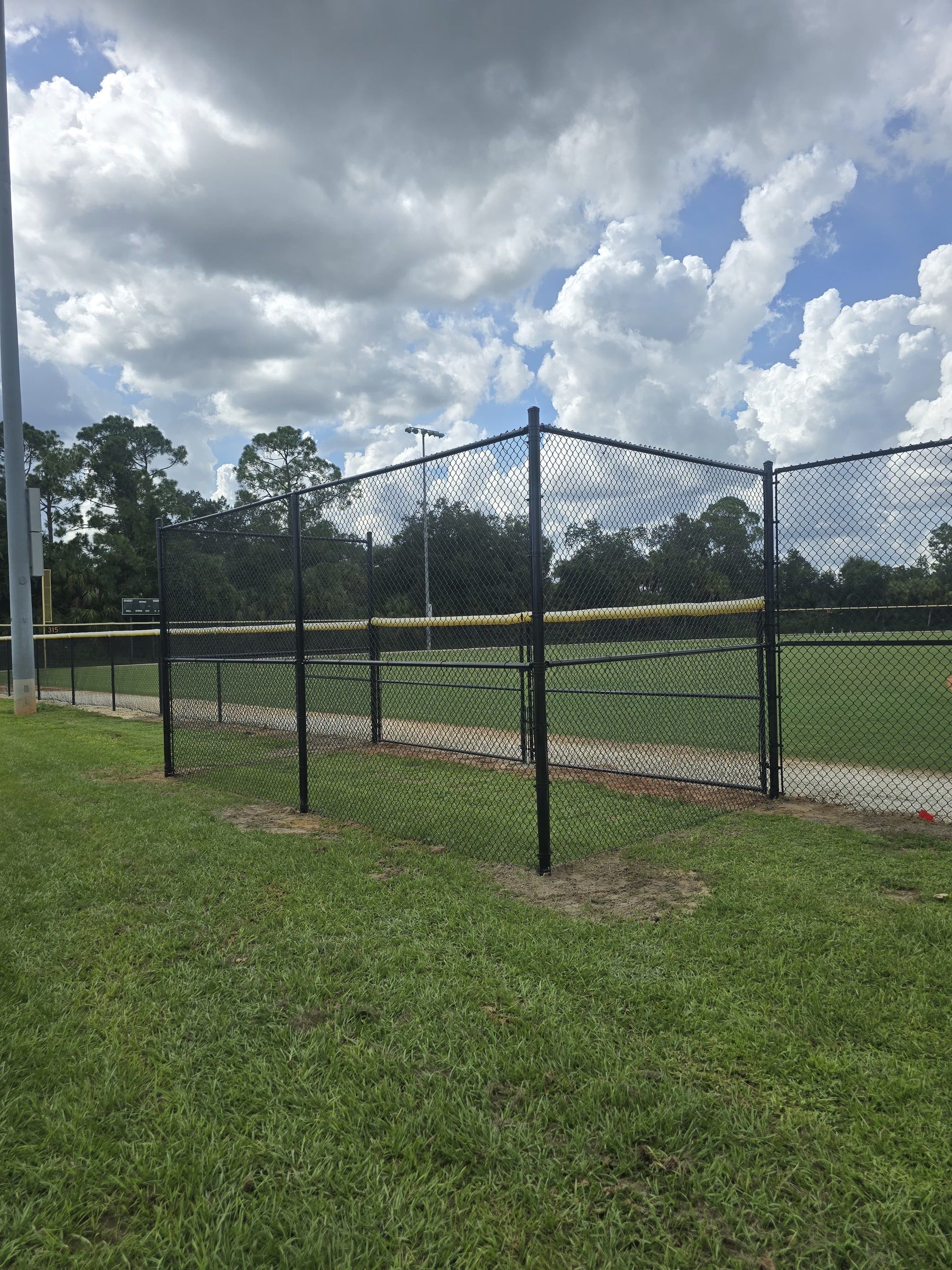 Commercial Black Chain Link Fence Installation in North Port by True Fence LLC