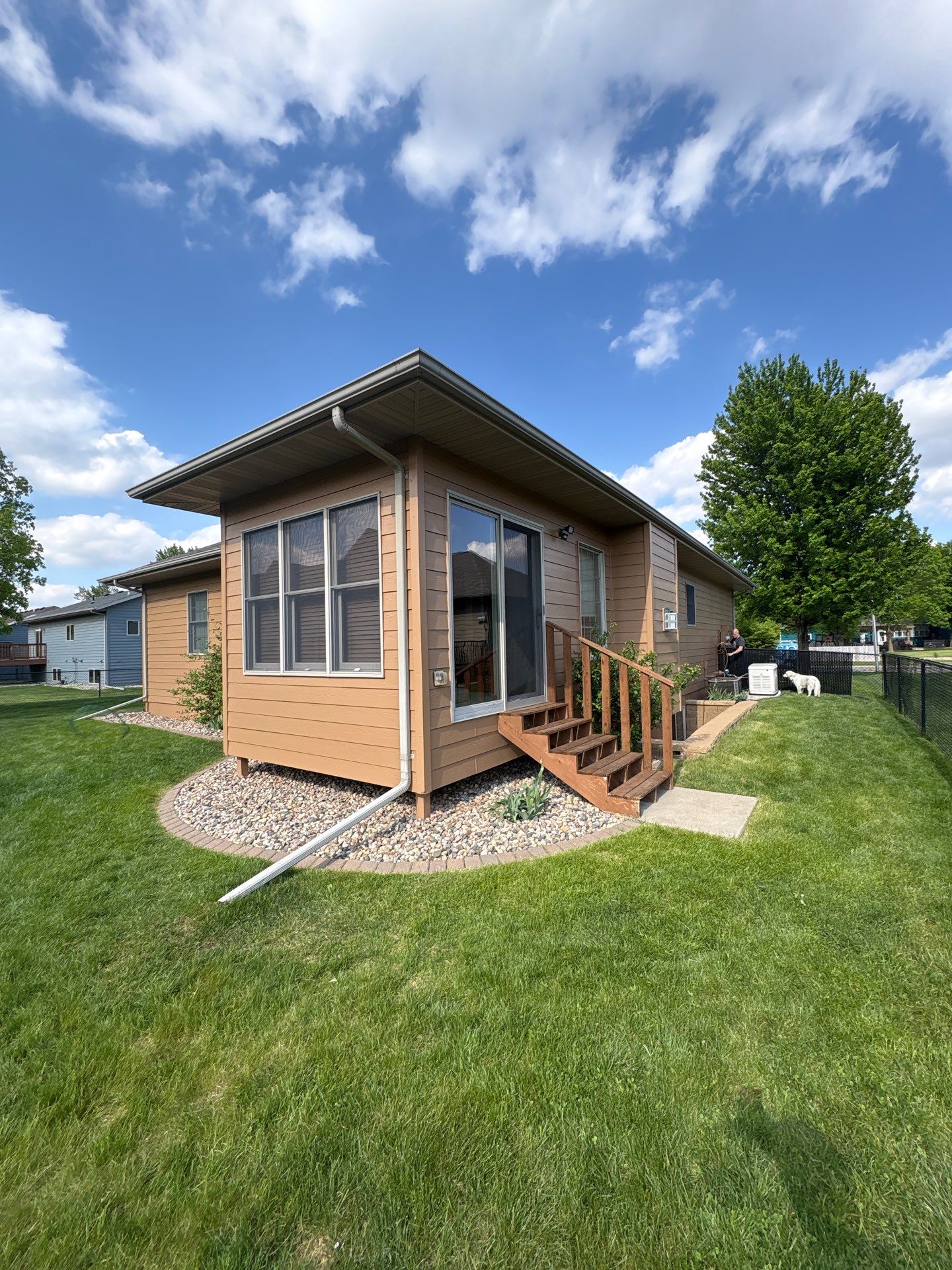 Sioux Falls Residential Exterior Door and Siding Refresh by Select Painting, Coatings & Garage Cabinets