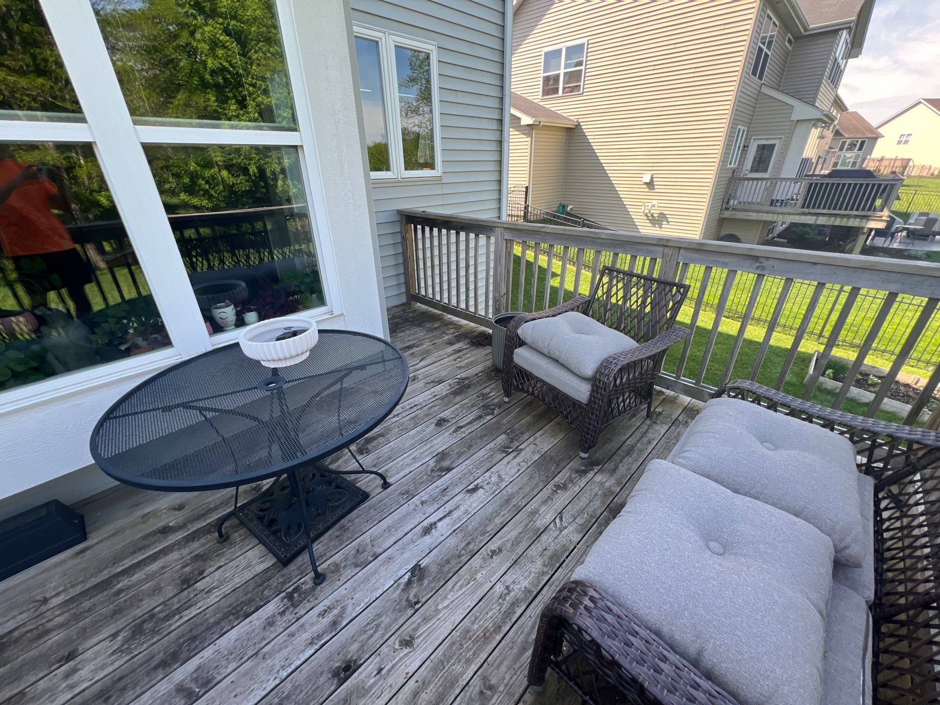 wood deck cleaning and staining by Northern Power Washing LLC.