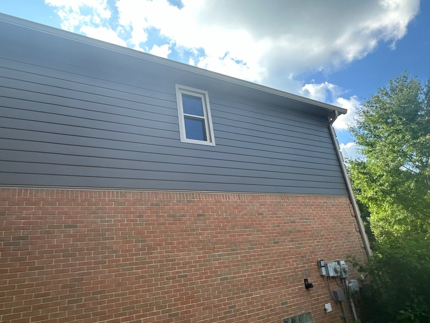 Roof Replacement using Owens Corning Peppercorn and Siding Replacement using Ascend Charcoal Smoke by 180 Contractors