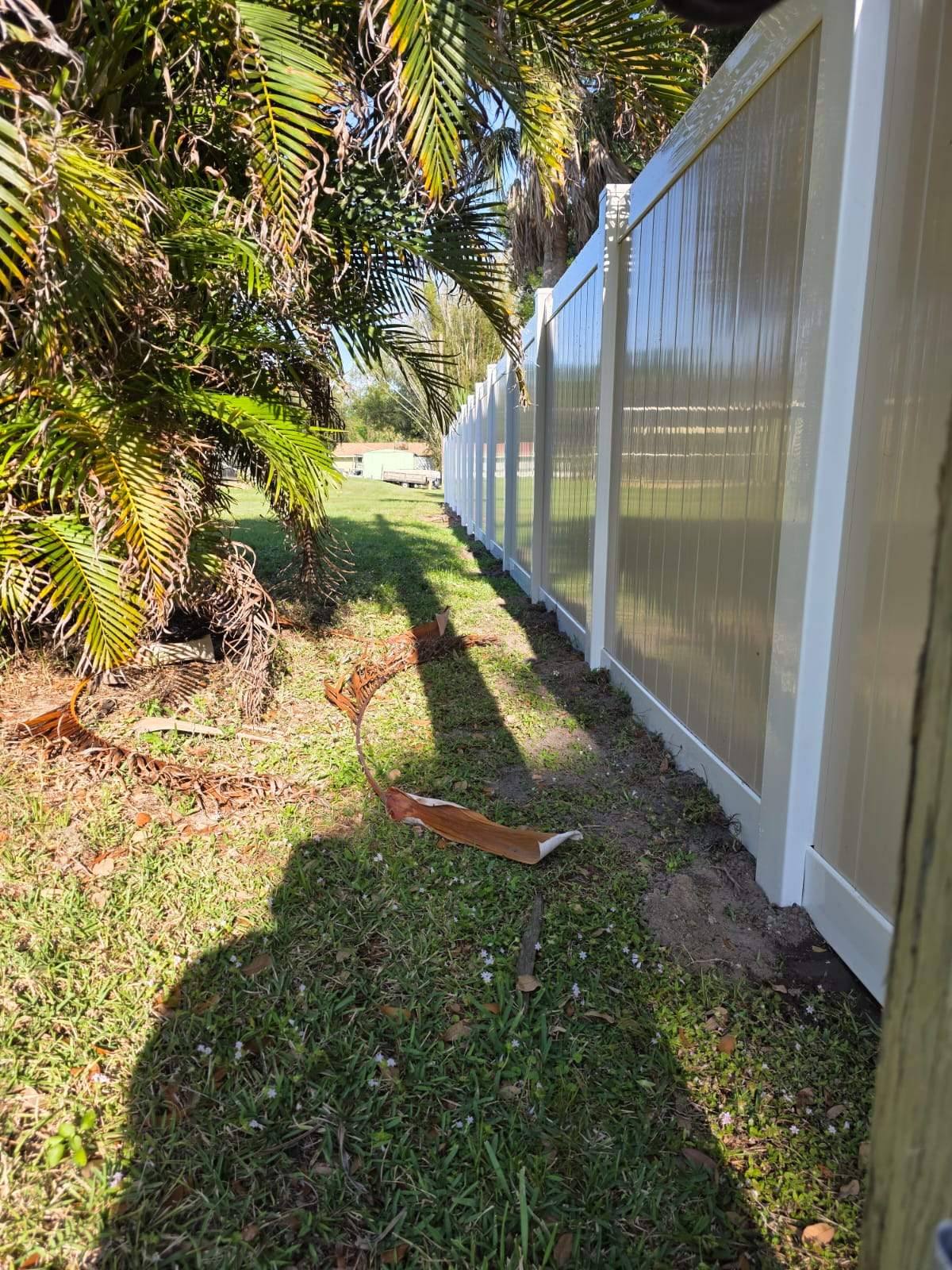Two-Tone Vinyl Privacy Fence Installation in Port Charlotte by True Fence LLC
