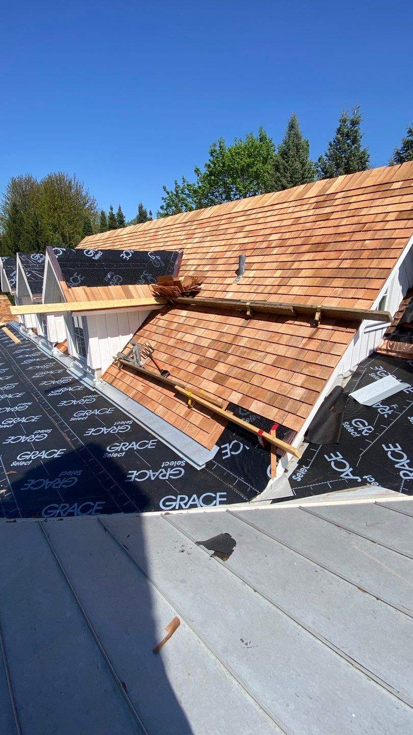 Cedar Shake Roof Replacement with Half Round Gutter Installation by Custom Installations
