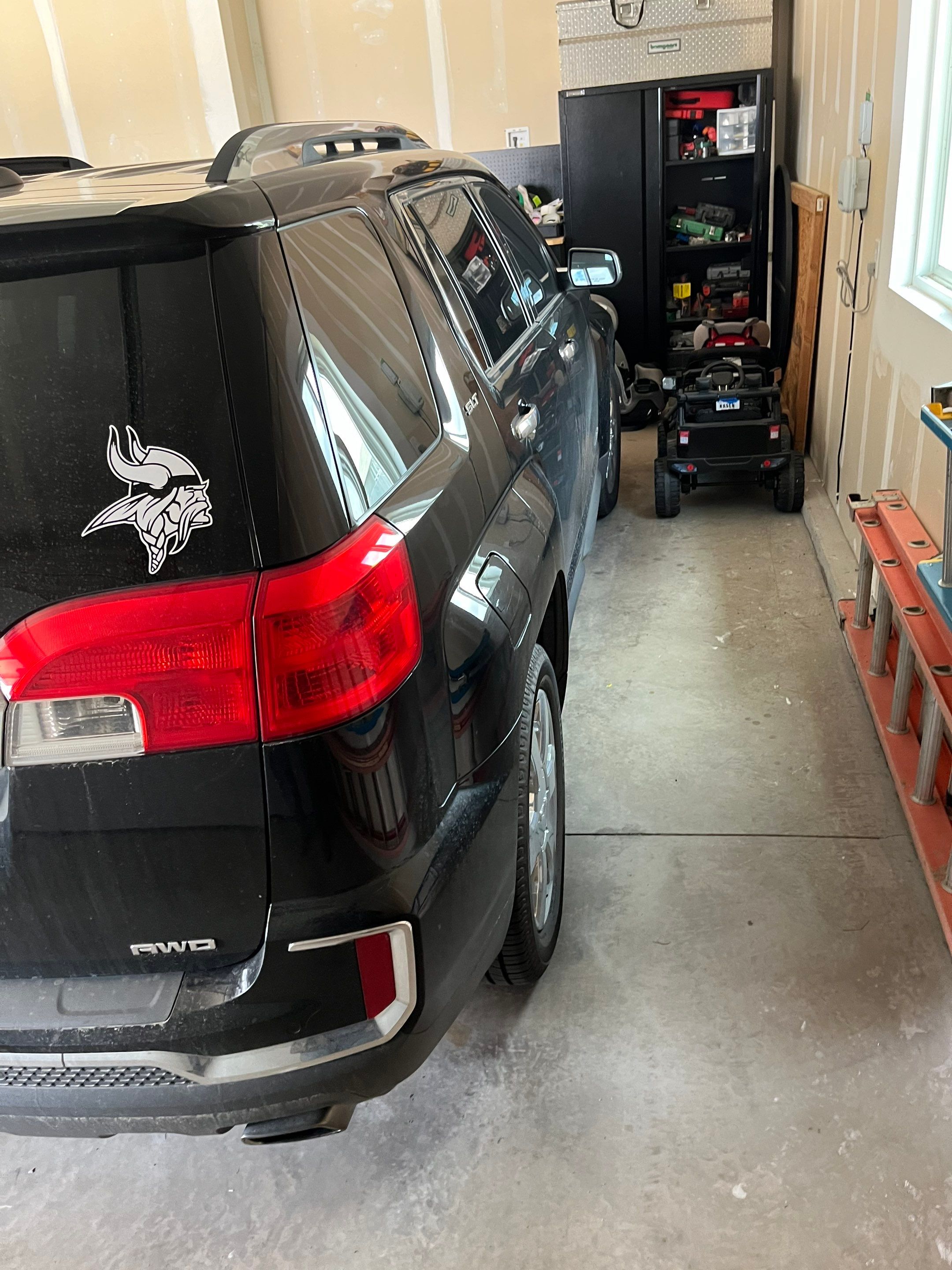 Grey Speckled Epoxy Garage Floor Coating in Sioux Falls by Select Painting, Coatings & Garage Cabinets