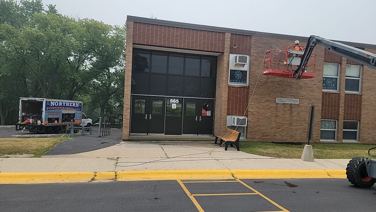 Commercial brick exterior cleaning by Northern Power Washing LLC.