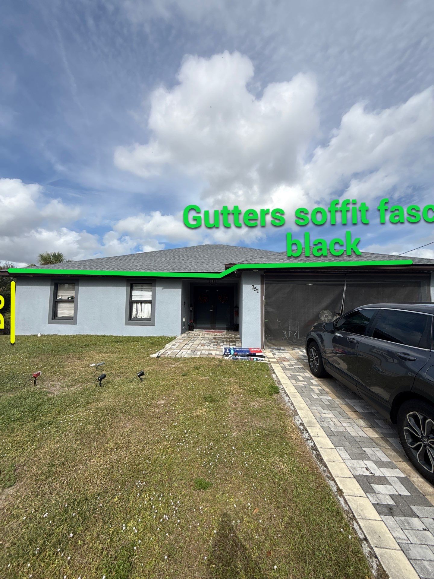 Black Seamless Gutters & Soffit/Fascia in Lehigh Acres FL by Gutter Professors