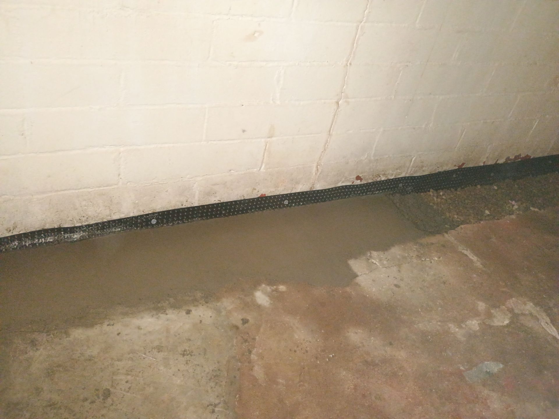 Interior Drain Tile & Sump Pump System in North Minneapolis by Waterproofing Northeast