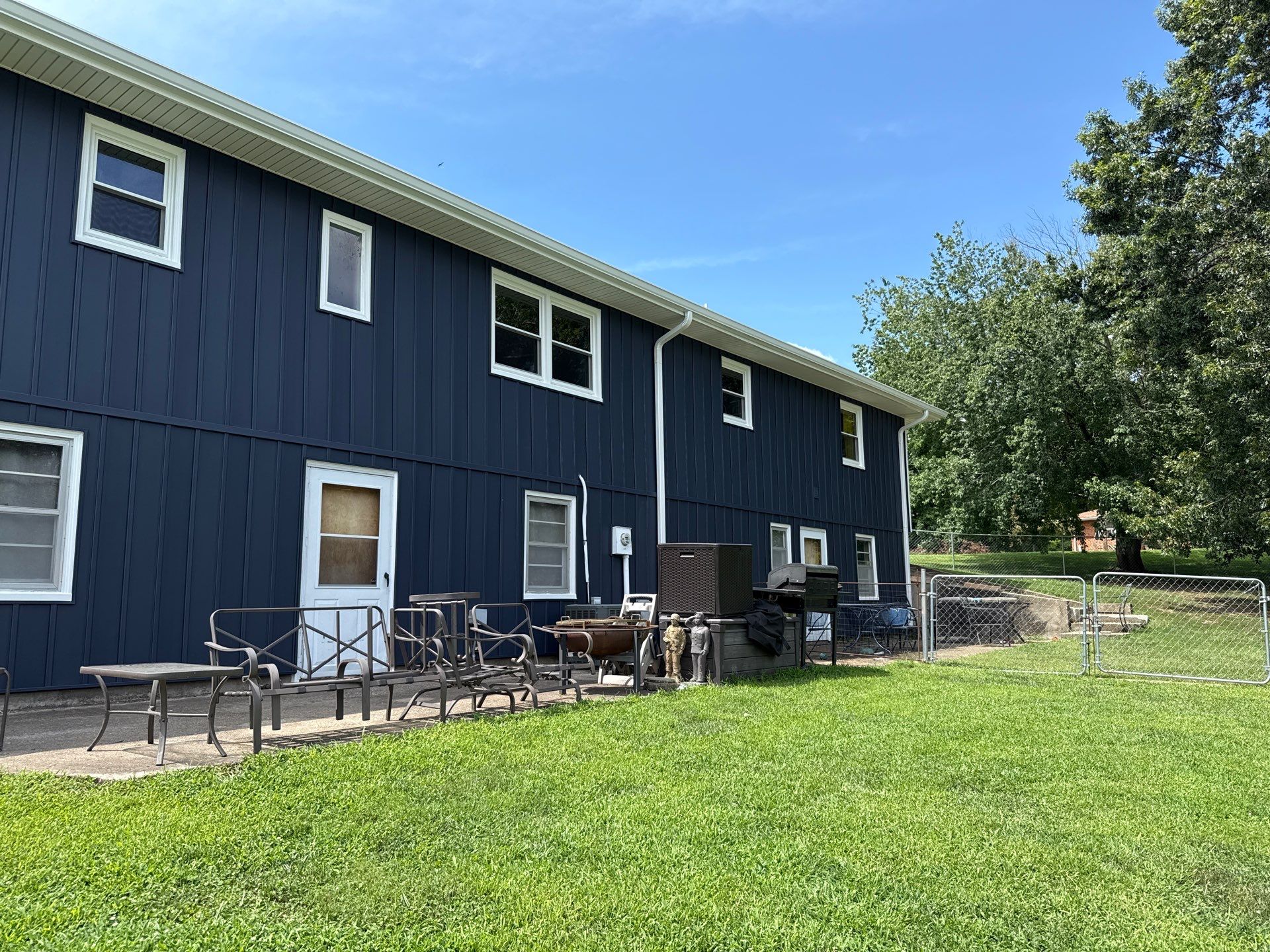 Indigo Board and Batten Siding and Window Replacement in Smithville by EEC Windows, Siding & Roofing