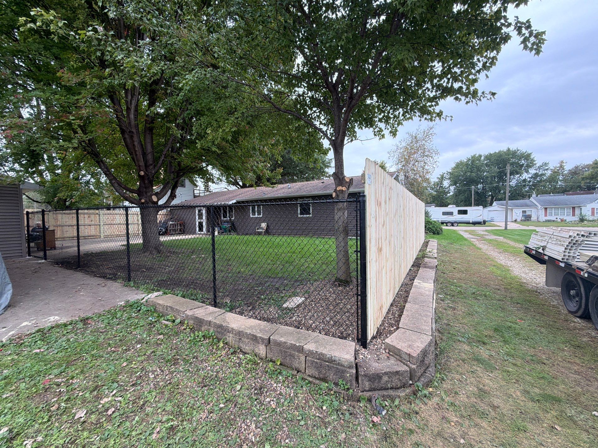 Custom Wood Privacy and Black Chain Link Fence in Hudson by Perfect Picket Fence and Stain
