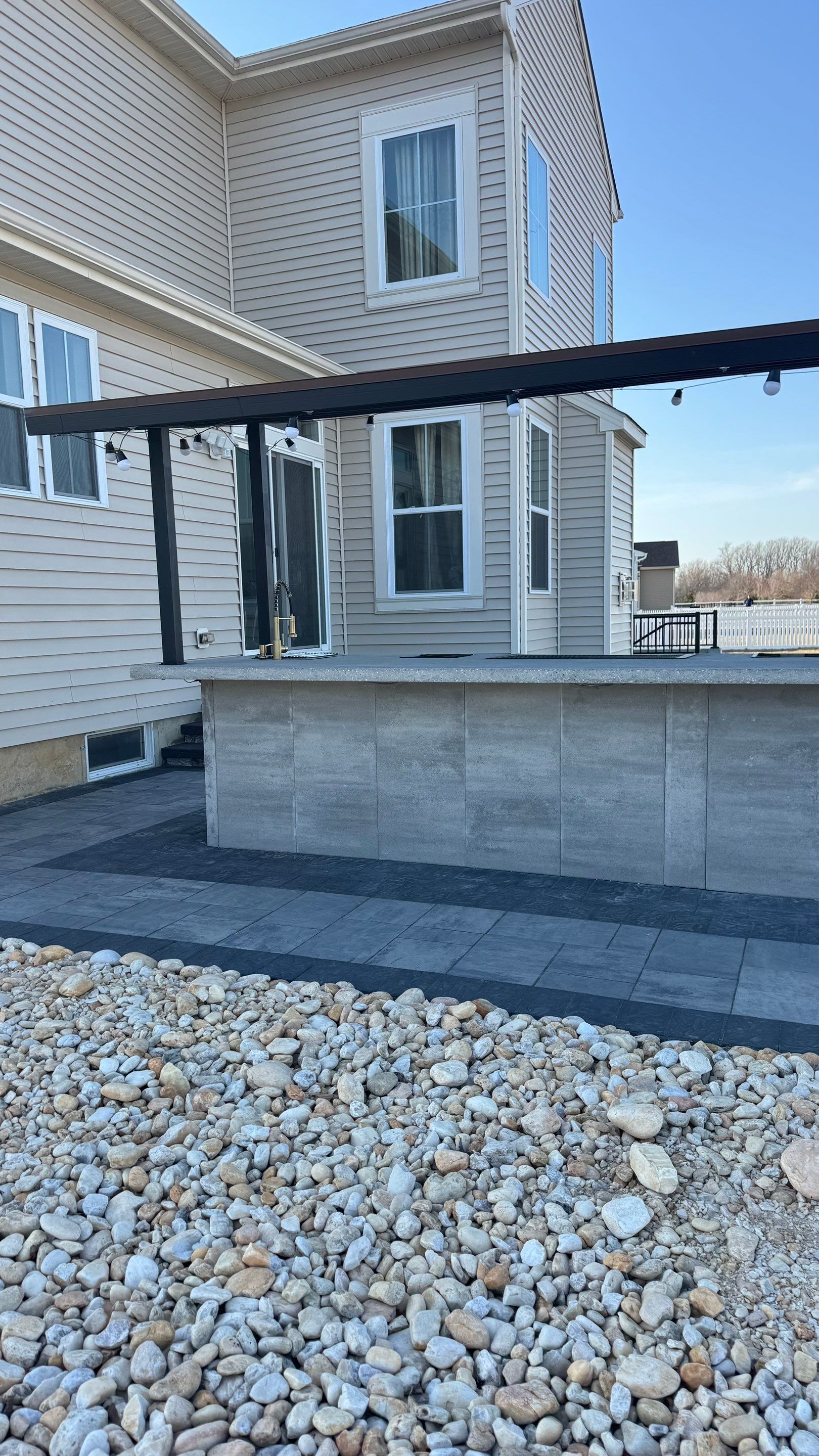 Custom Belgard patio by Studio G Indoor Spaces & Outdoor Living