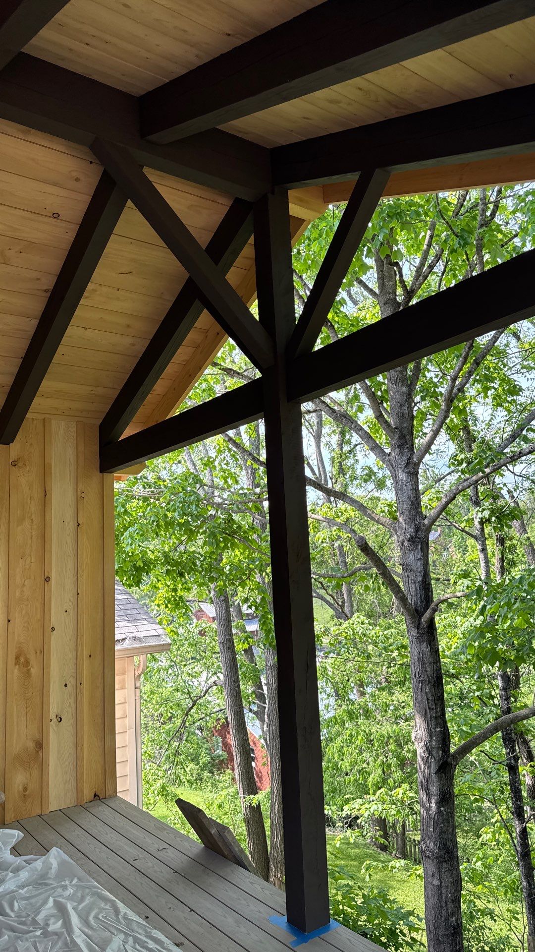 Custom Composite Deck with Stone Fireplace and Modern Cable Railing by Walnut Hollow Decks & Outdoor Living