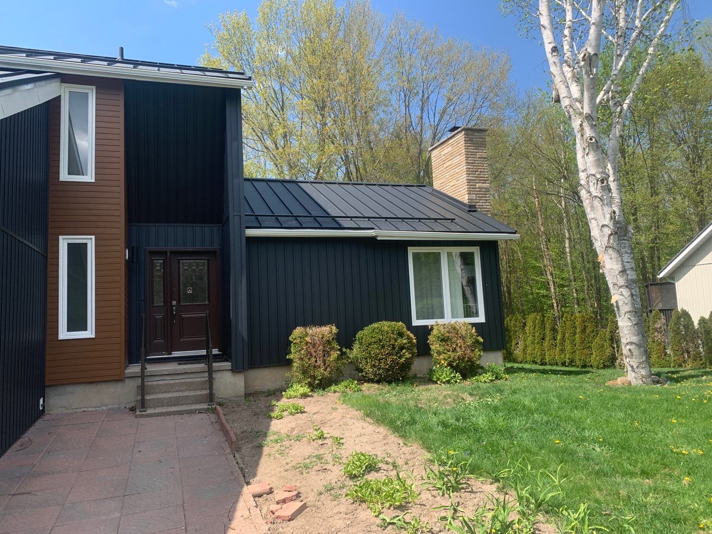 Residential Roofing Installation using 16" Standing Seam Panels by Jay Carter Roofing & Sheet Metal