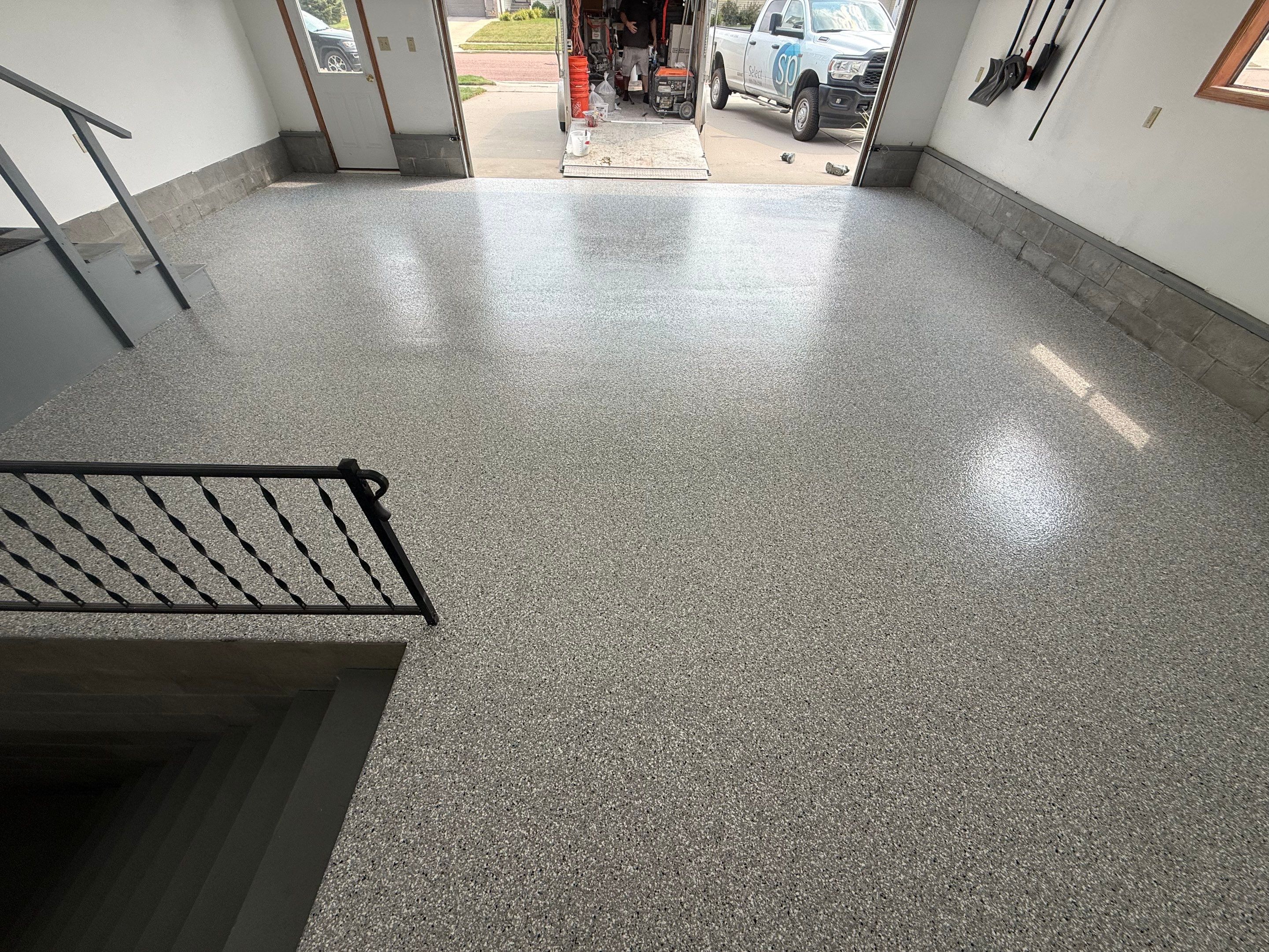 Feather Grey Garage Floor Coating and Concrete Restoration in Mitchell by Select Painting, Coatings & Garage Cabinets