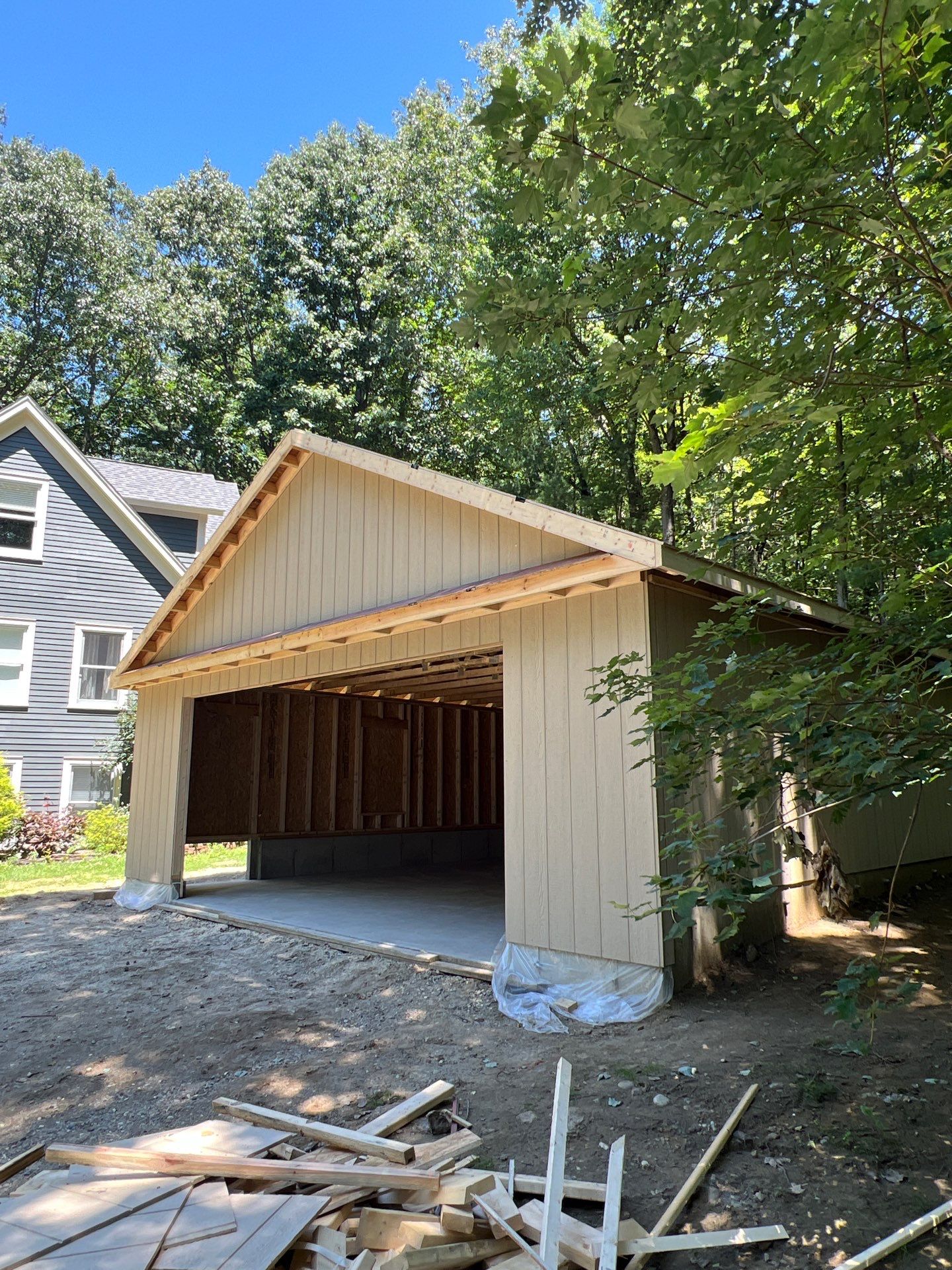 Garage using LP SmartSide Panel Siding by Chagnon Building & Remodeling LLC