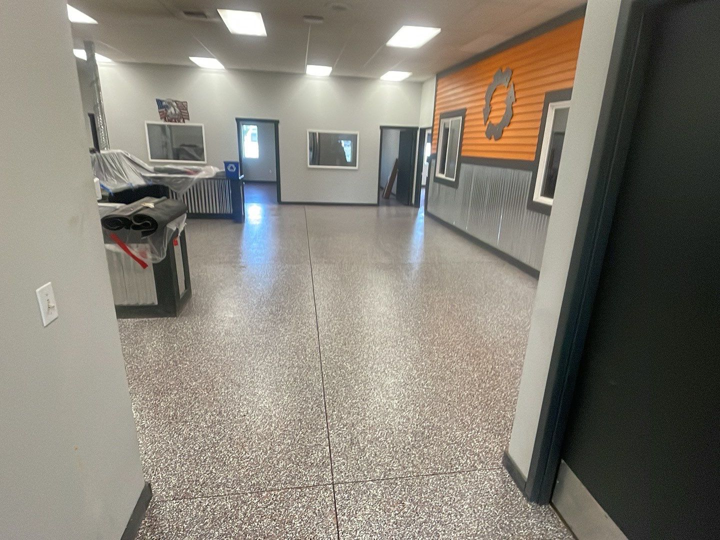 Equipment Share Commercial Floor Transformation using Smoke w/ 5% Orange by Croc Coatings, LLC