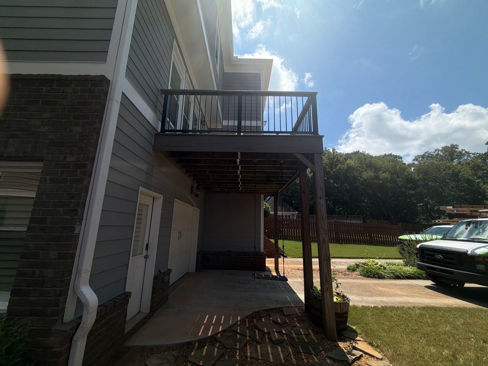 Elevated Composite Deck Replacement with Metal Railings in Smyrna by Swift Home Renovations 