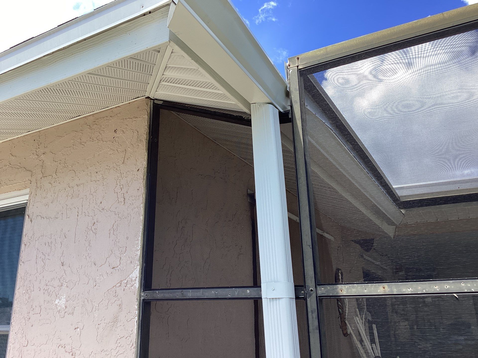 White Seamless Gutters and Splash Guards in Fort Myers FL by Gutter Professor by Gutter Professors