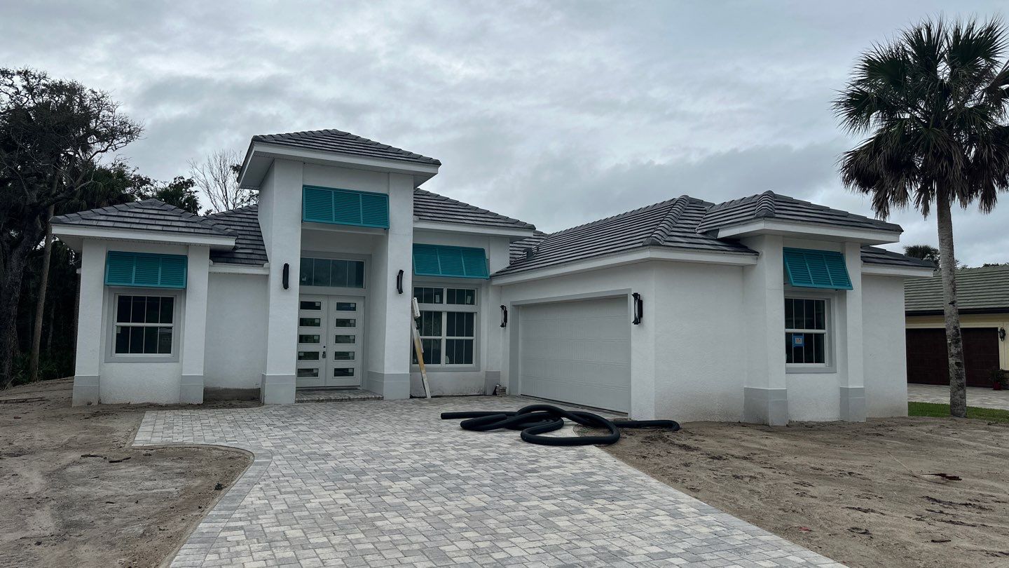 Bahama Shutters in Turquoise Blue  by Smart Guard Shutters