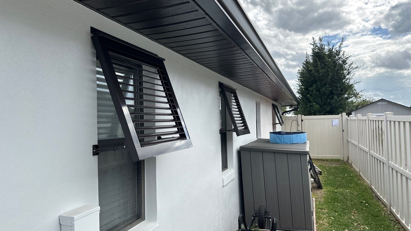 Bahama Shutters in Grey Brown by Smart Guard Shutters